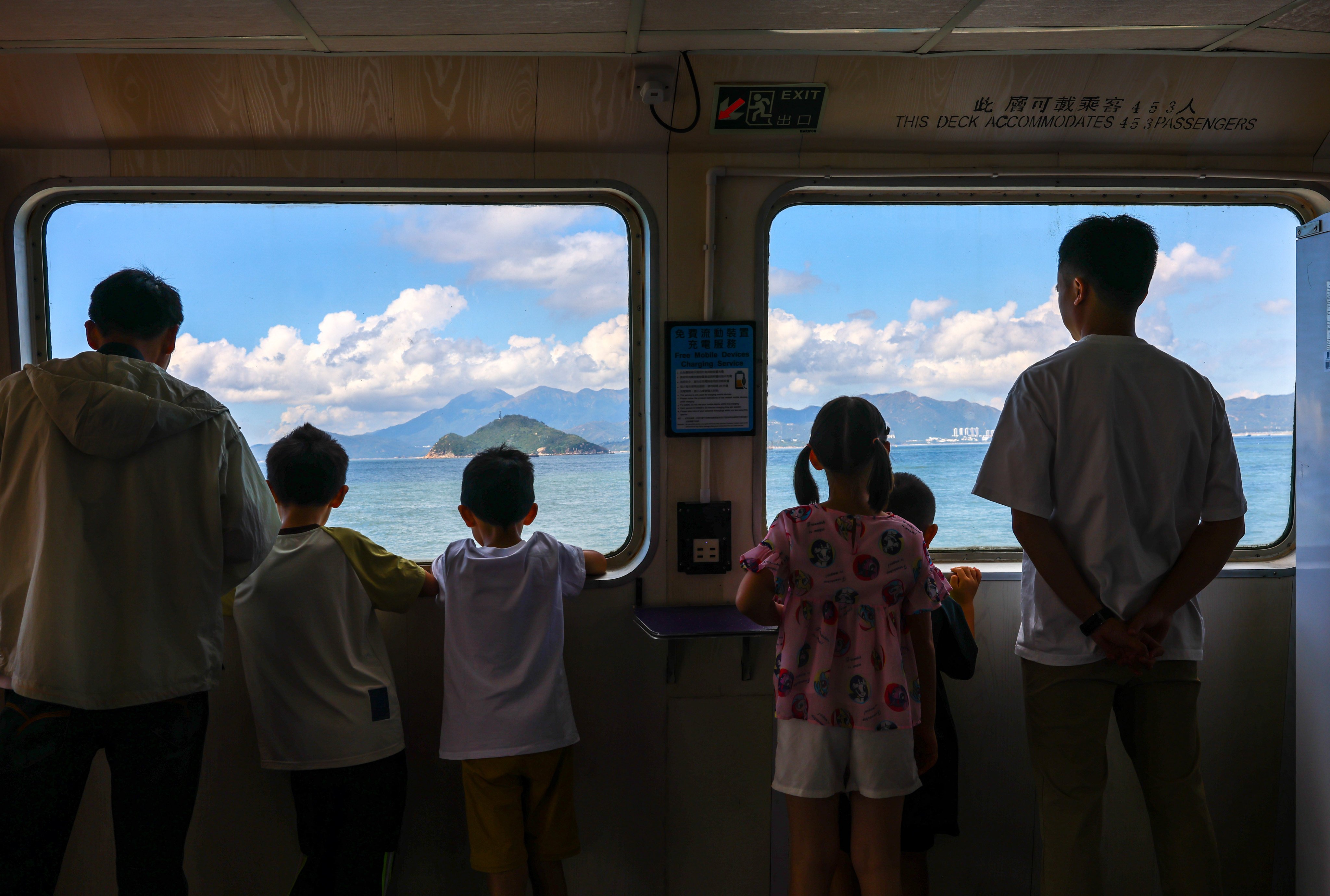 Passengers enjoy the view on a ferry from Central to Cheung Chau on October 2, 2025. Photo: Dickson Lee
