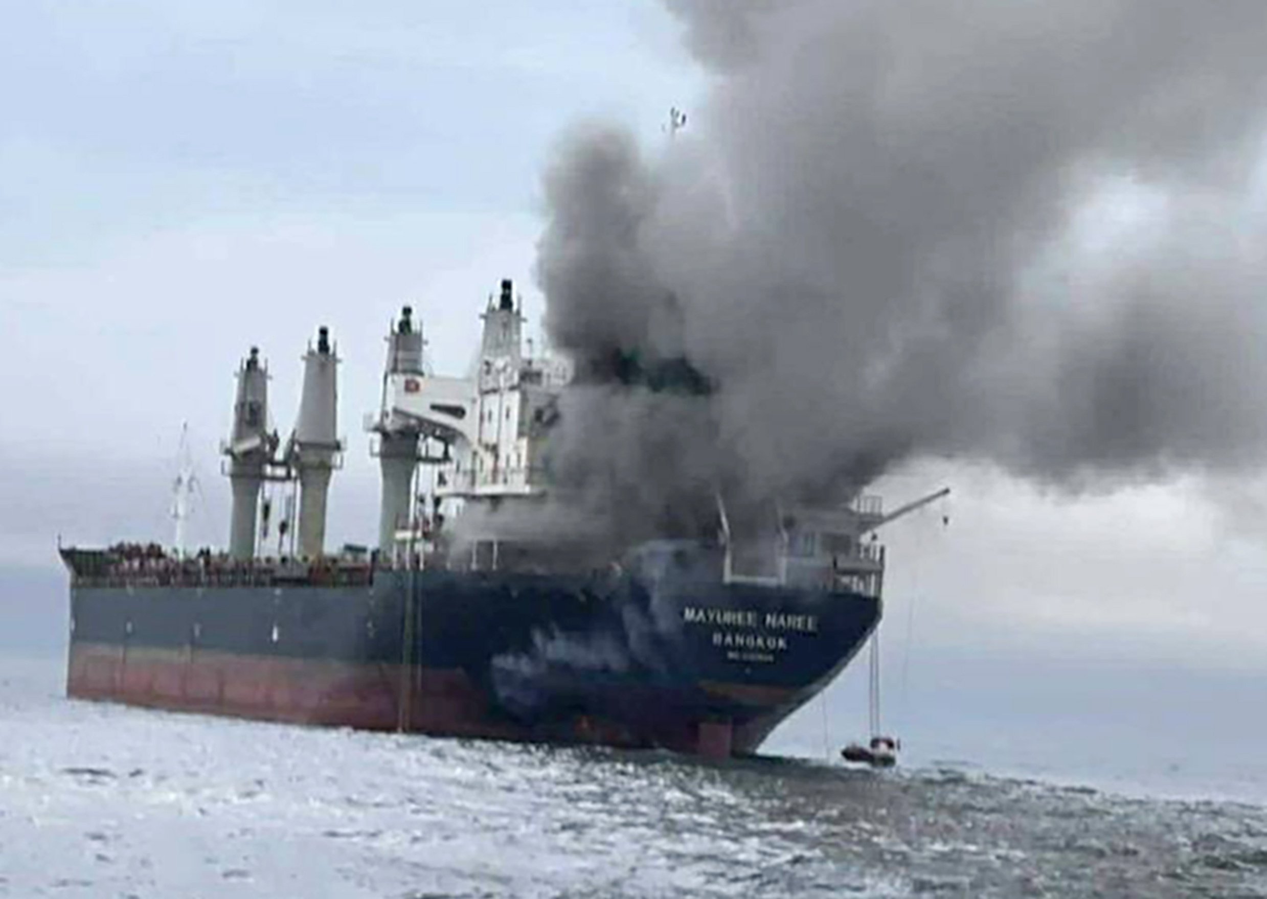 The Thai‑flagged cargo ship Mayuree Naree on fire after being hit by Iranian missiles in the Strait of Hormuz on Wednesday. Photo: EPA/Royal Thai Navy