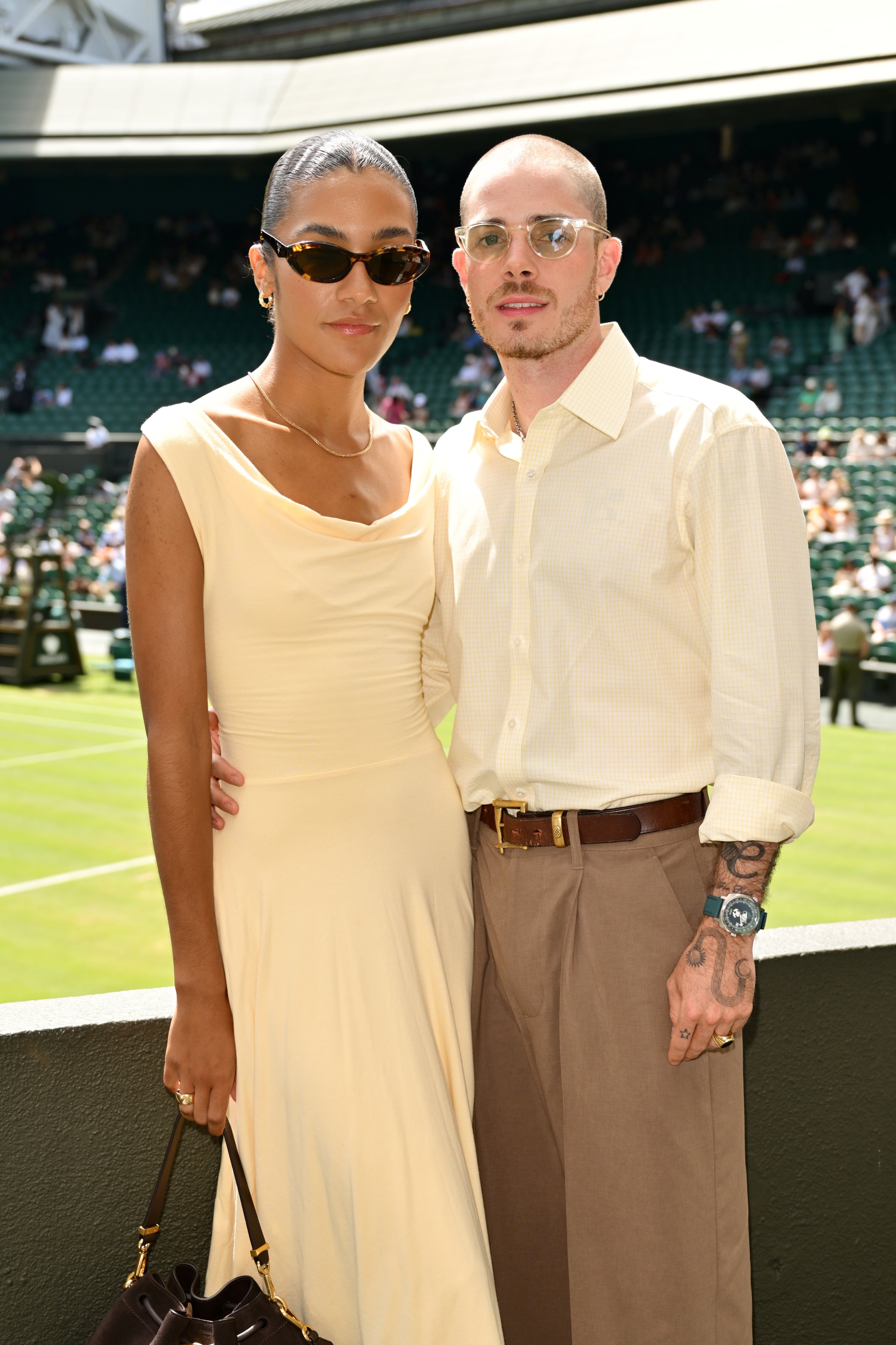 Olivia Dean and Eddie Burns arrived at Wimbledon last July in matching outfits. Photo: Getty Images