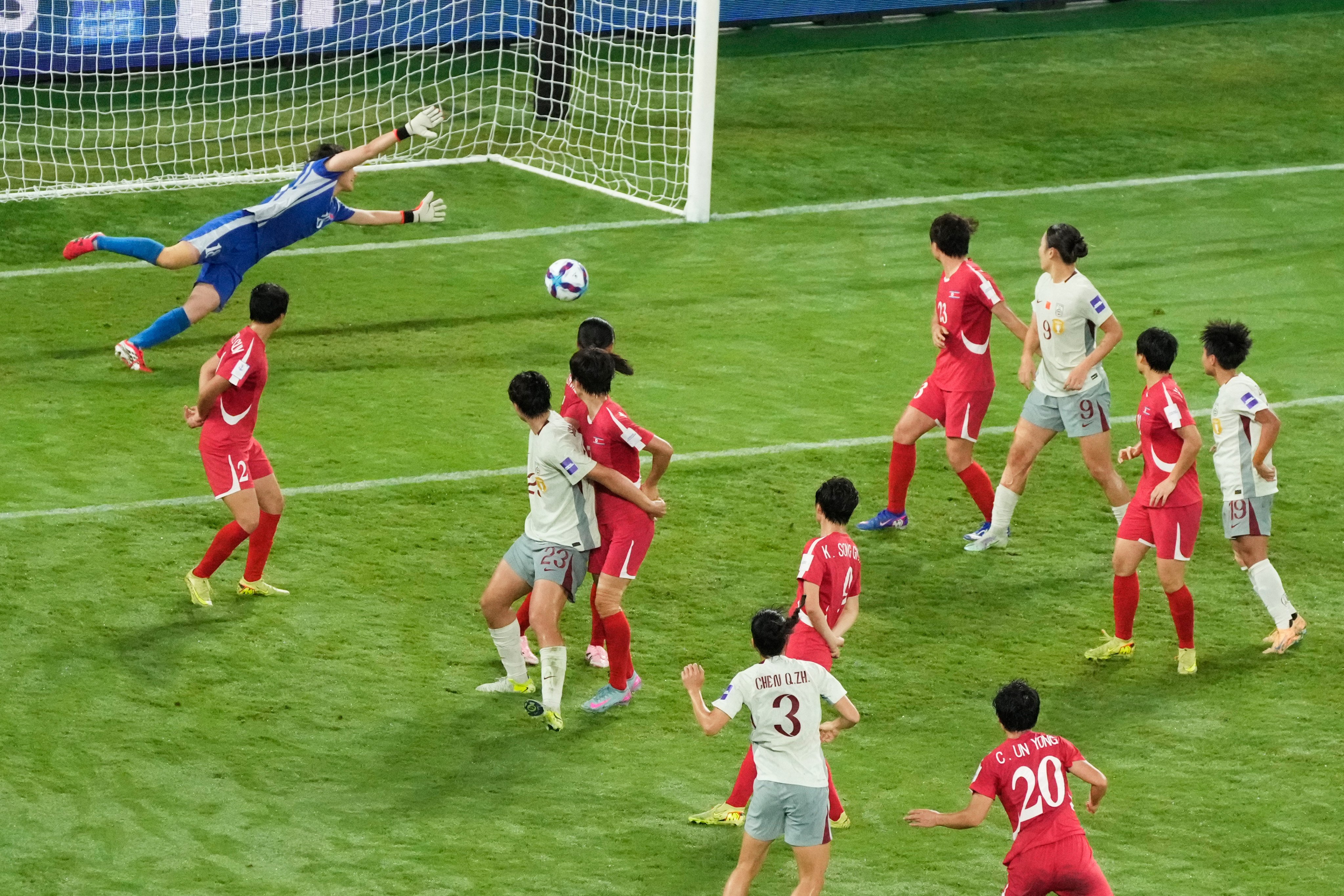 North Korean goalkeeper You Son-gum (top) fails to stop Chen Qiaozhu (3) scoring her team’s first goal in China’s 2-1 group match win on Monday. Photo: AP