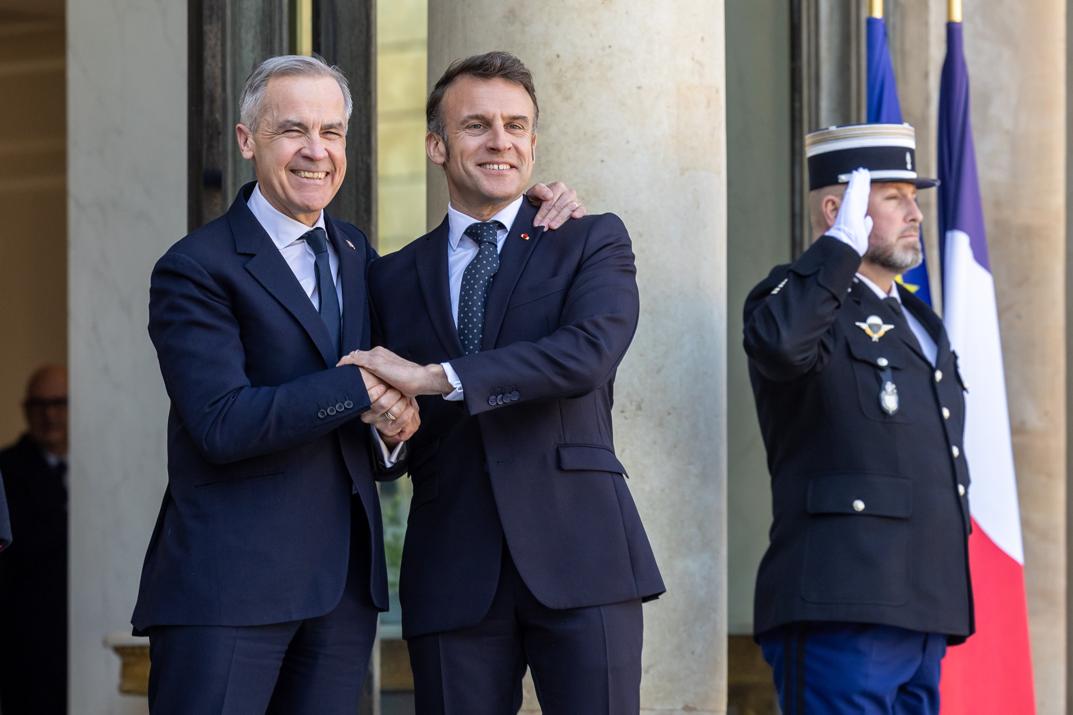 French President Emmanuel Macron shakes hand with Canadian Prime Minister Mark Carney in Paris, France, last year. Photo: EPA-EFE