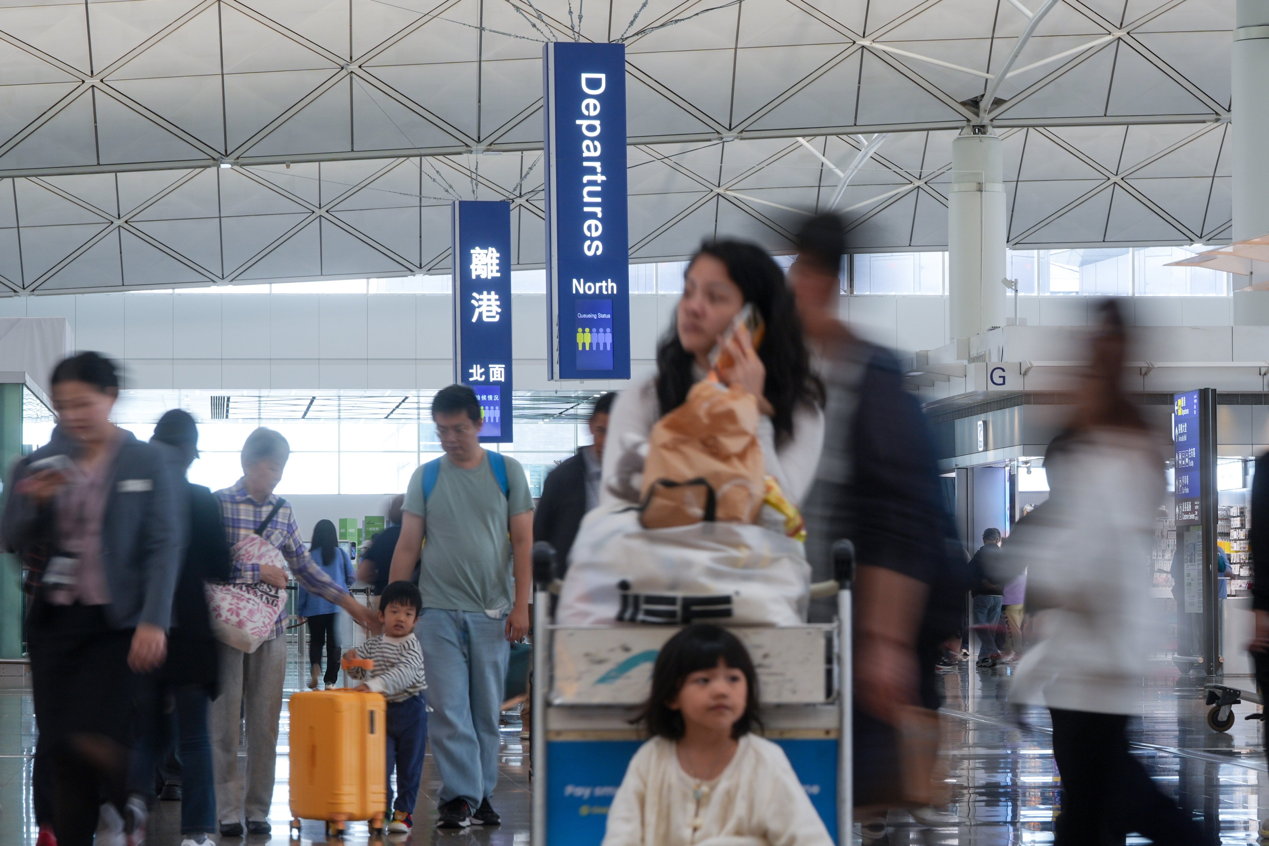 Travellers at Hong Kong International Airport in Chek Lap Kok on Monday afternoon. Cathay Pacific halts Dubai and Riyadh flights until Thursday amid US-Israeli strikes on Iran. 02MAR26. SCMP / Eugene Lee