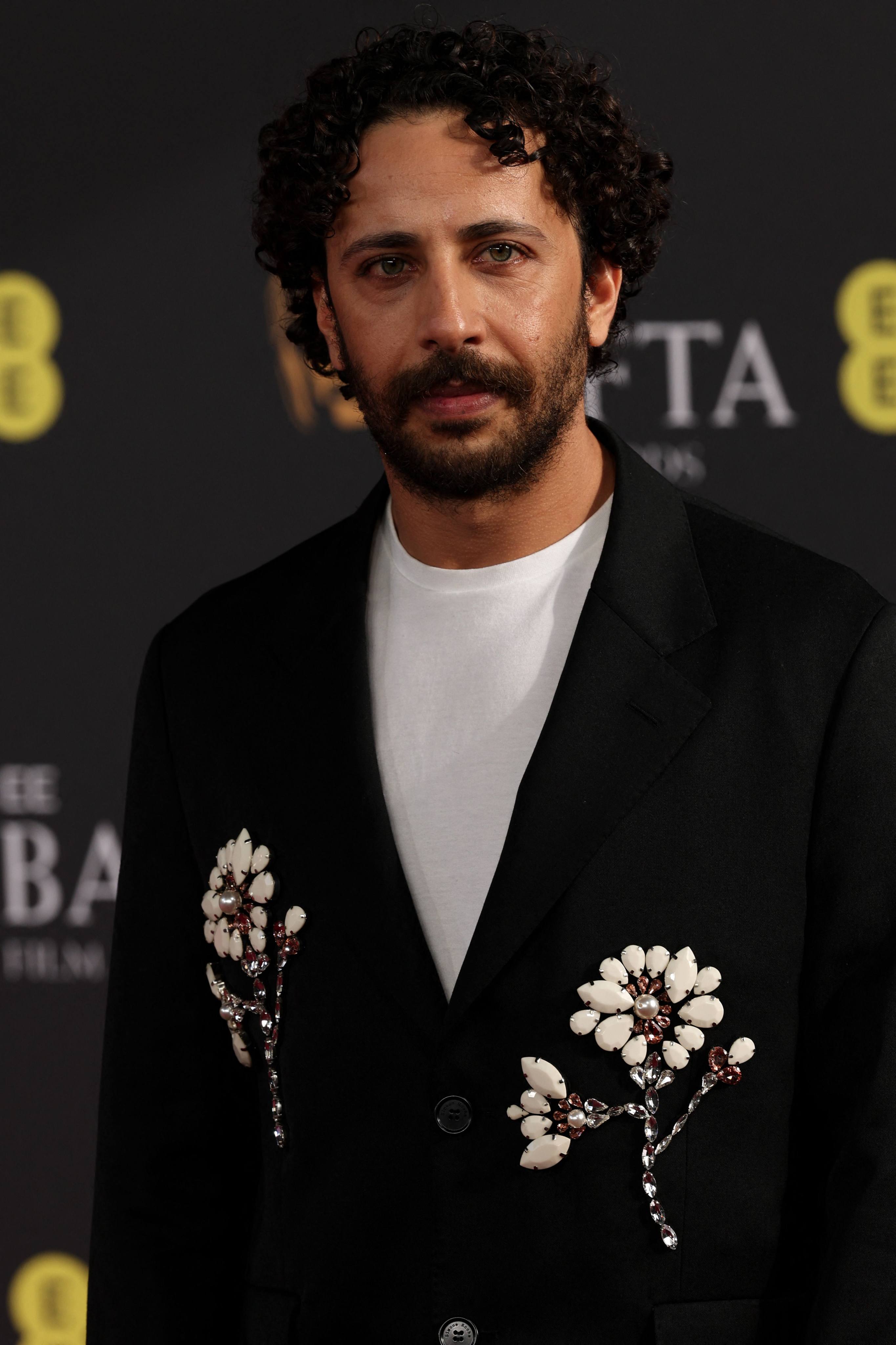 Palestinian actor Motaz Malhees poses on the red carpet at the Bafta award ceremony on February 22. Photo: AFP