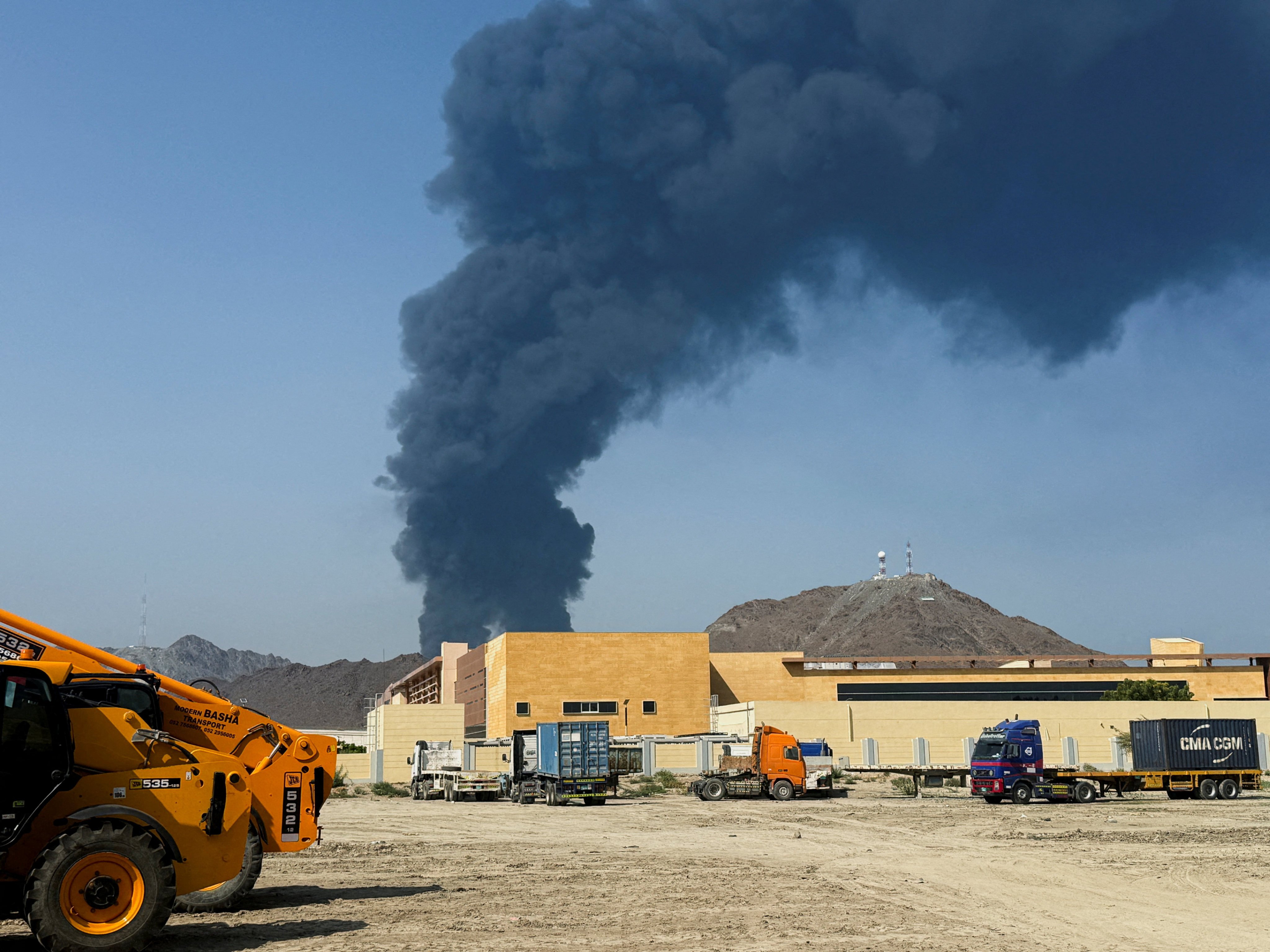 Smoke rises in the Fujairah oil industry zone, caused by debris after interception of a drone by air defences, according to the Fujairah media office, amid the US-Israel conflict with Iran, in Fujairah, the United Arab Emirates, on Saturday. Photo: Reuters