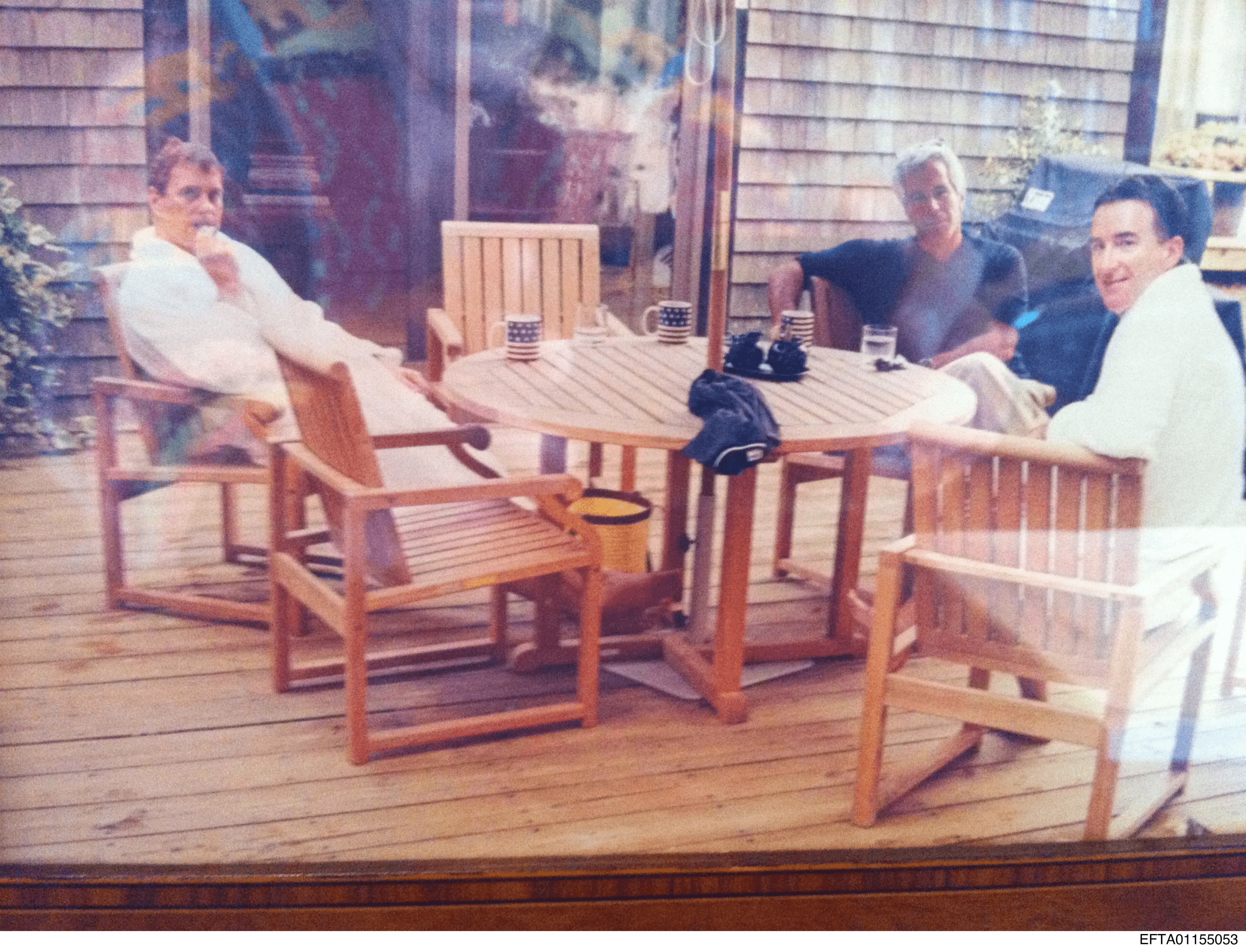 An undated image shows Jeffrey Epstein (centre) sitting with Andrew Mountbatten-Windsor and Peter Mandelson. Photo: US Department of Justice via AP