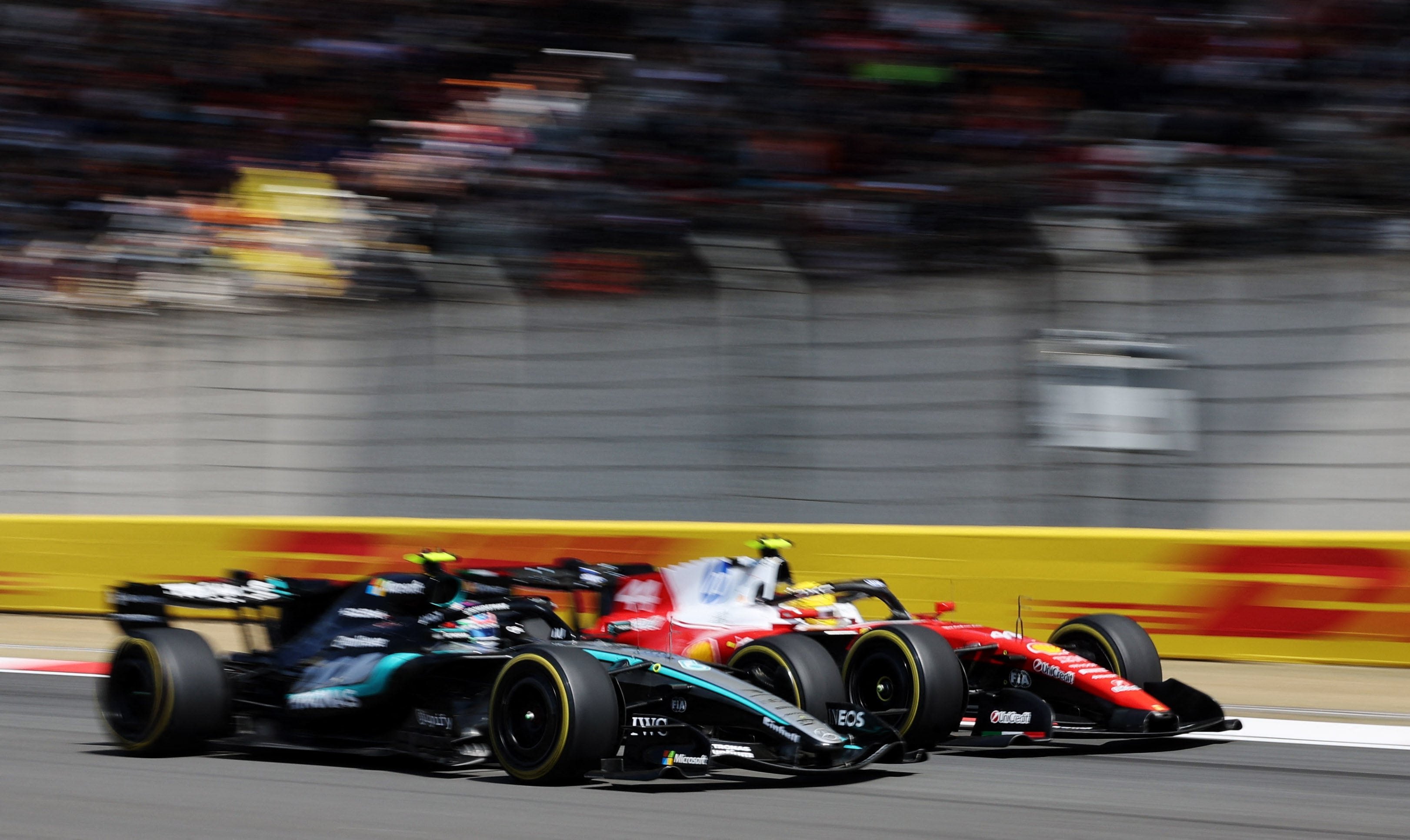 Mercedes’ George Russell (left) and Ferrari’s Lewis Hamilton exchanged the lead several times in the opening laps of the Chinese Grand prix sprint race on Saturday. Photo: Reuters