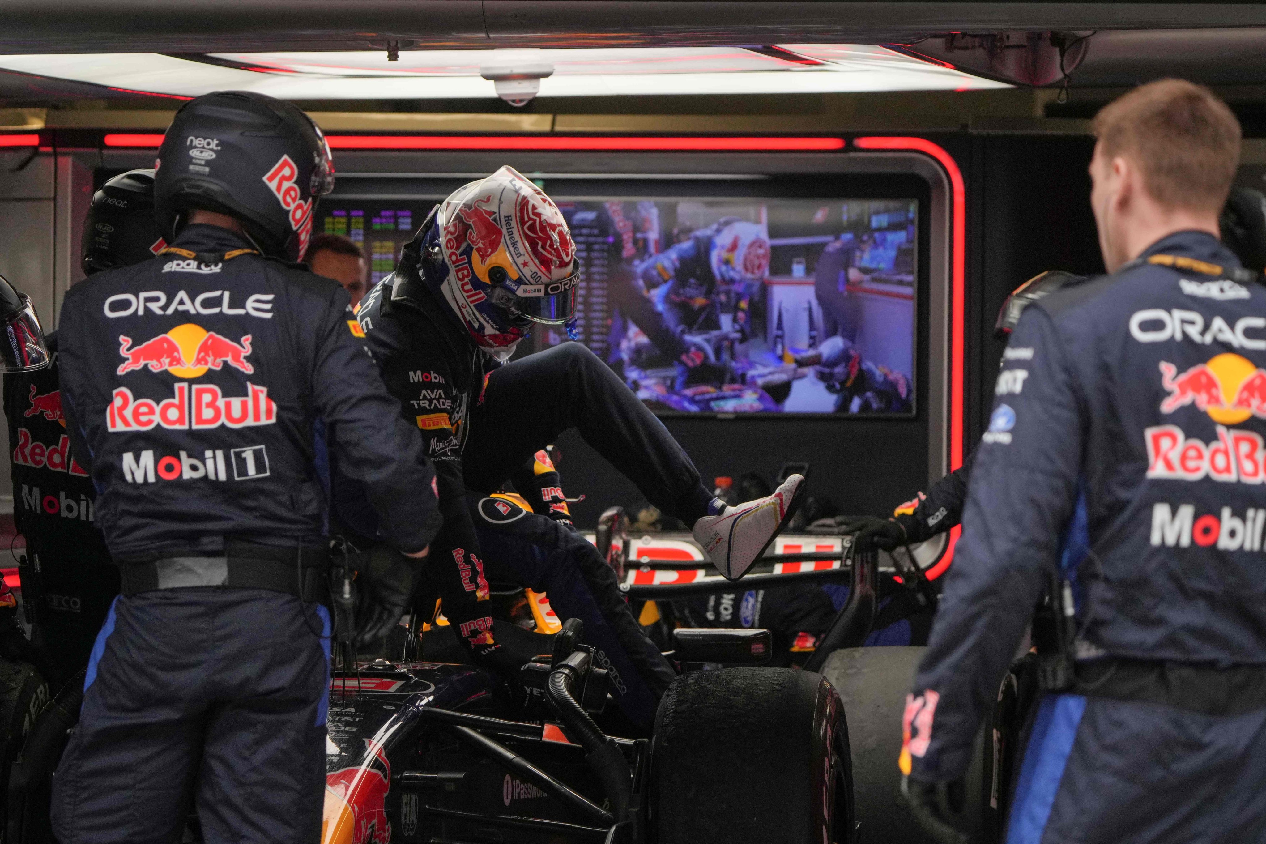 Red Bull’s Max Verstappen (centre) gets out of his car after retiring during the Chinese Grand Prix at the Shanghai International Circuit on Sunday. Photo: AFP