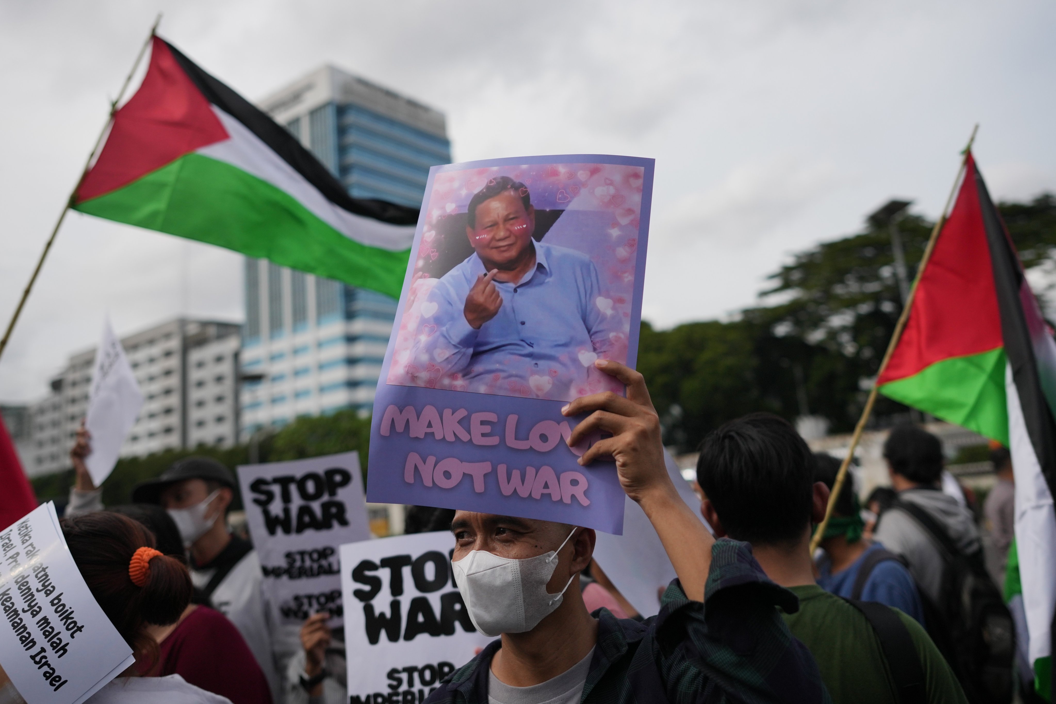 A protester displays a poster of Indonesian President Prabowo Subianto during a Jakarta rally against the country’s participation in the US-led “Board of Peace” on March 6. Photo: AP