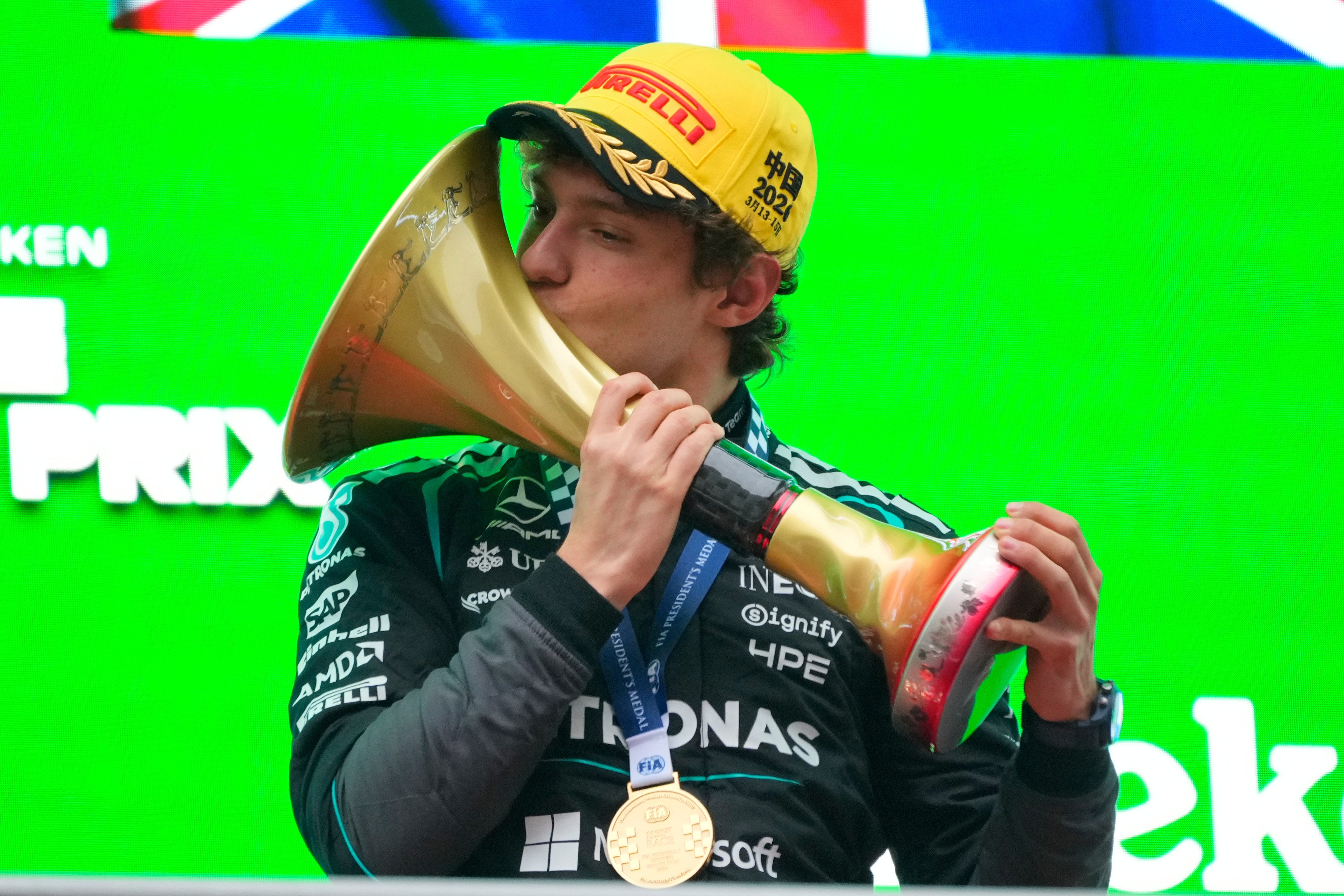 Race winner Kimi Antonelli of Mercedes kisses the trophy as he celebrates winning the Chinese Grand Prix at the Shanghai International Circuit on Sunday. Photo: AP