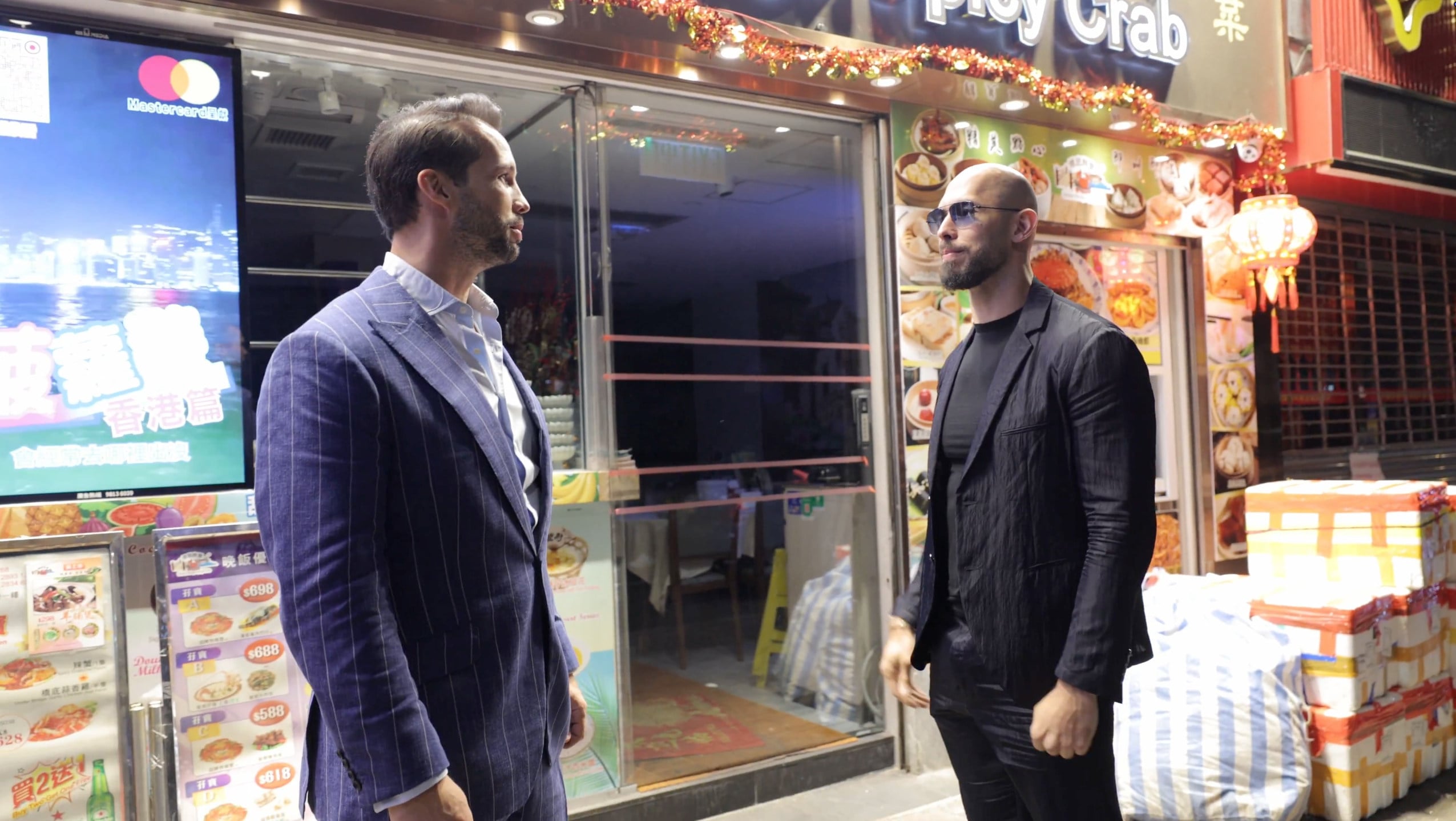 Andrew Tate (right) with his brother Tristan outside a restaurant in Hong Kong. Photo: X/Andrew Tate