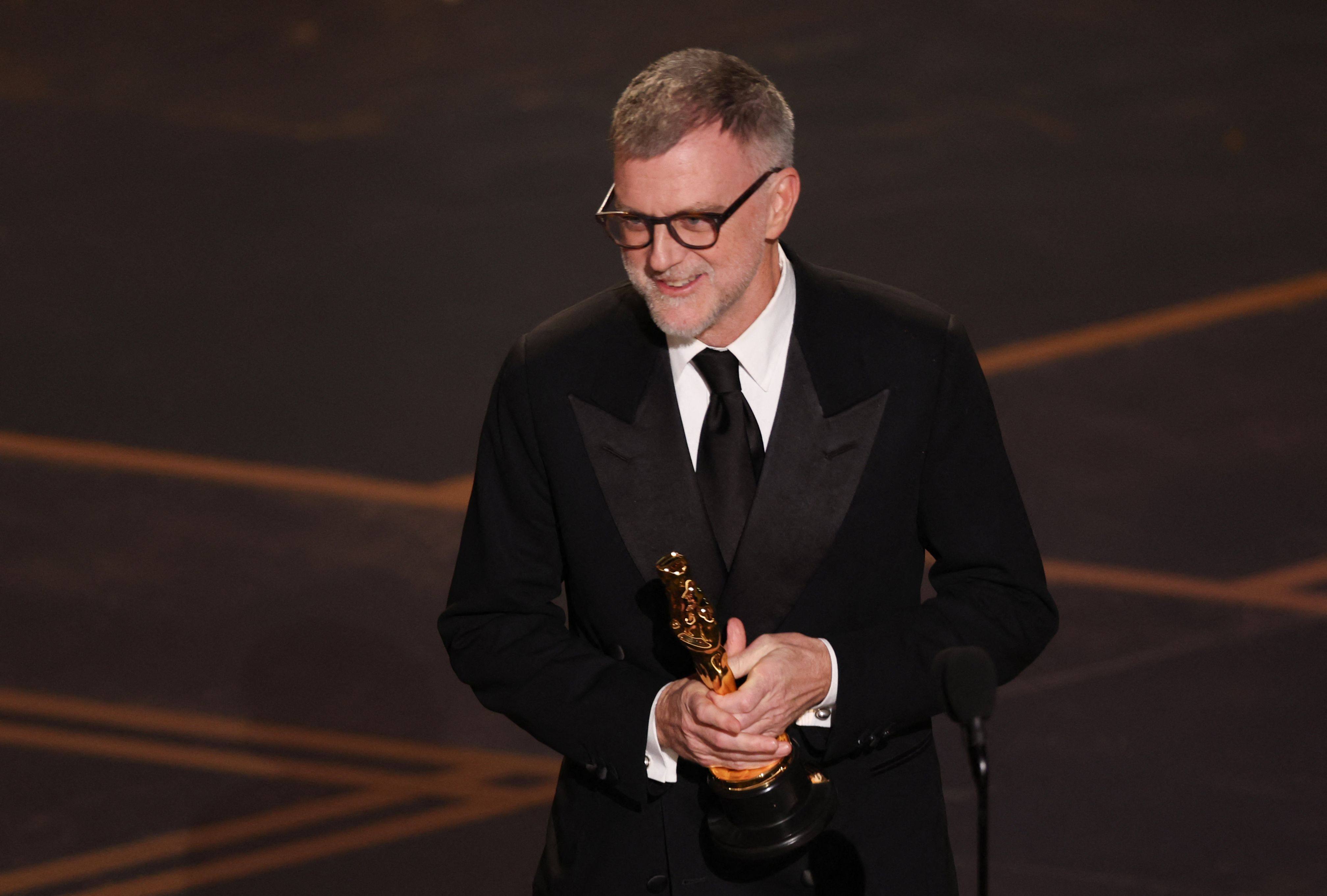 US filmmaker Paul Thomas Anderson accepts the Oscar for best writing (adapted screenplay) for One Battle After Another onstage during the 98th Annual Academy Awards at the Dolby Theatre in Hollywood, California, on March 15, 2026. Photo: AFP