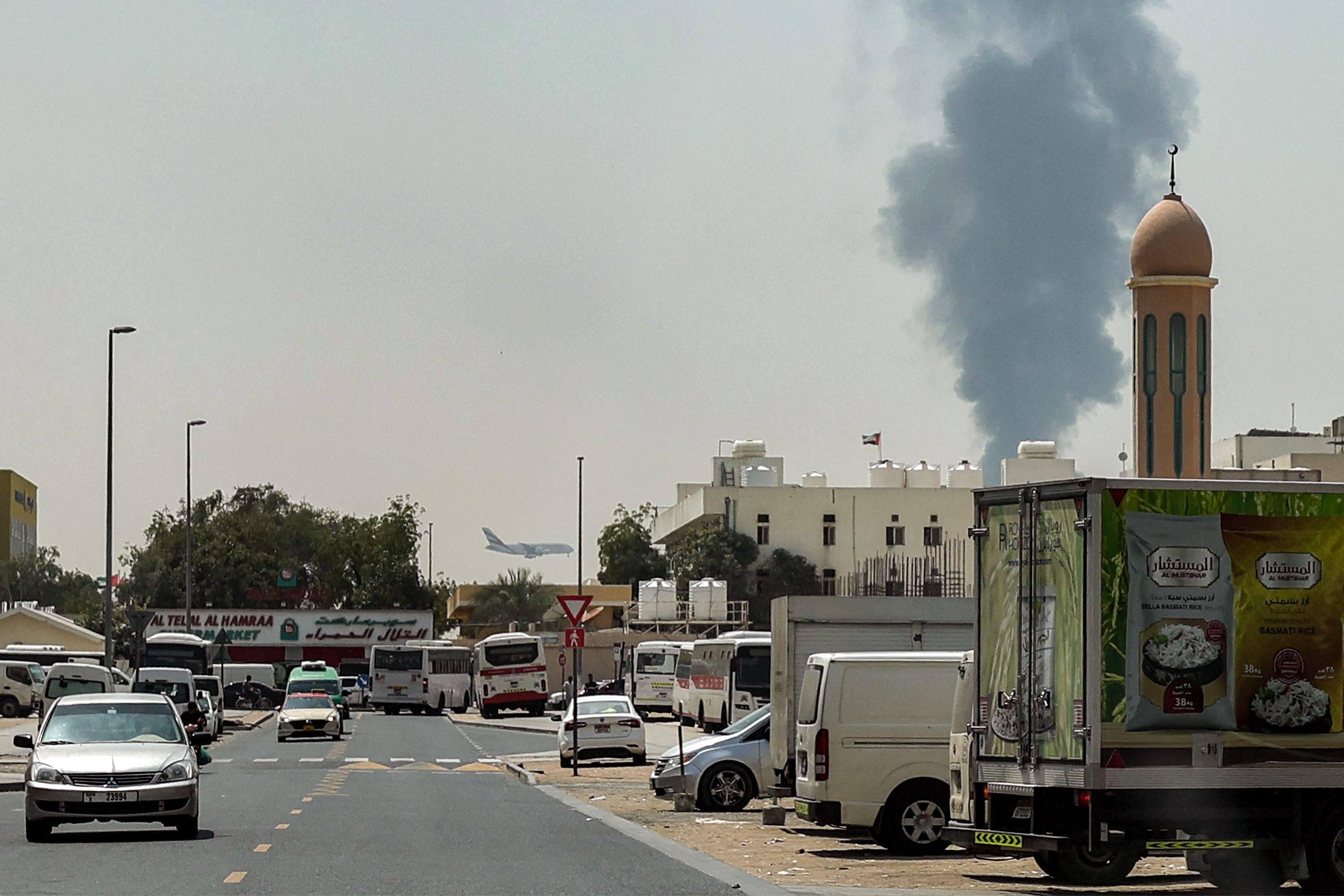 Smoke rises from an ongoing near Dubai International Airport. Photo: AFP