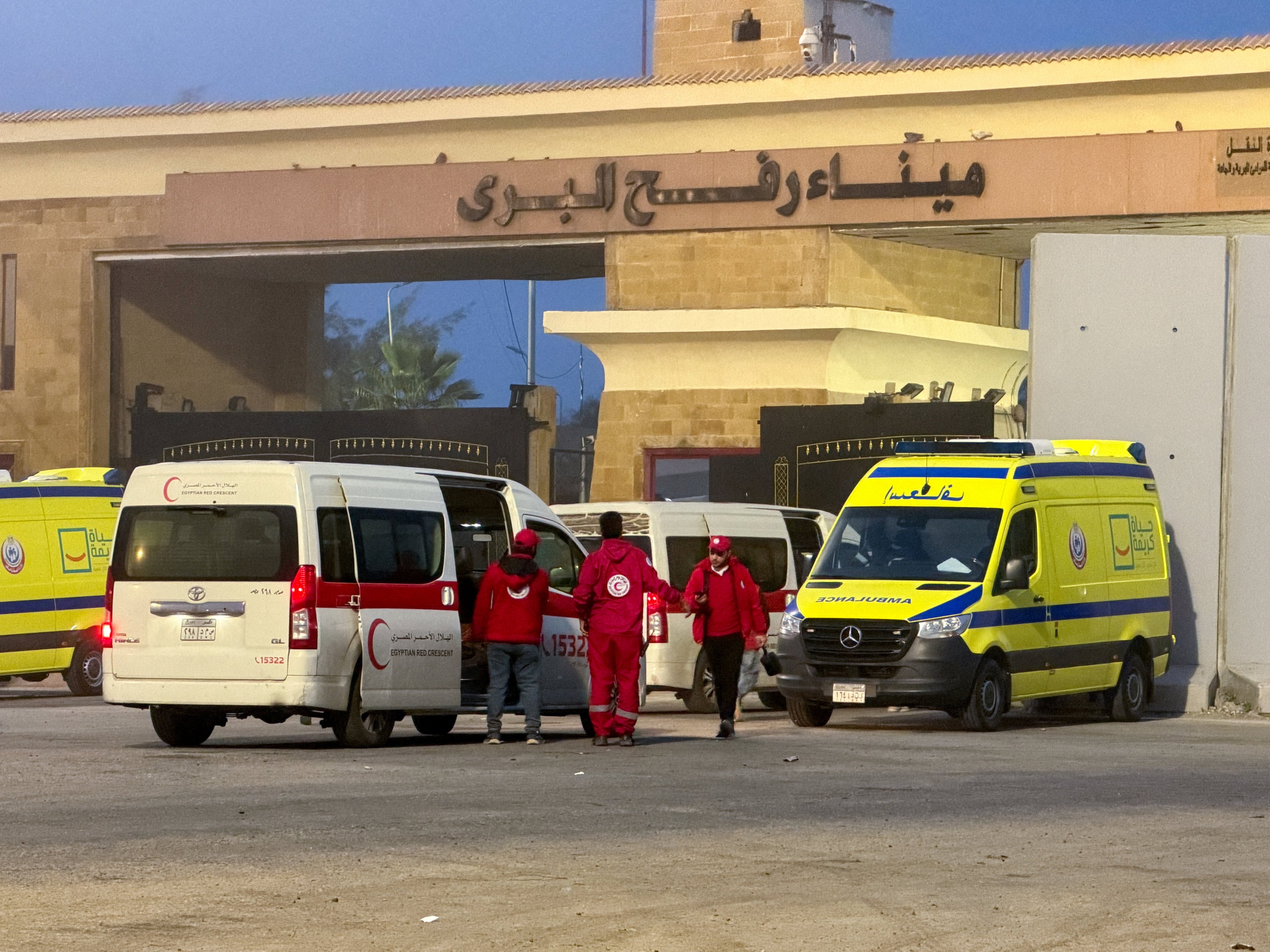 Egyptian ambulances go through the Rafah border crossing on the Egyptian side in Rafah, Egypt on February 10. On Sunday, Israel said the crossing will ​open on Wednesday for limited movement of people in both directions. Photo: Reuters