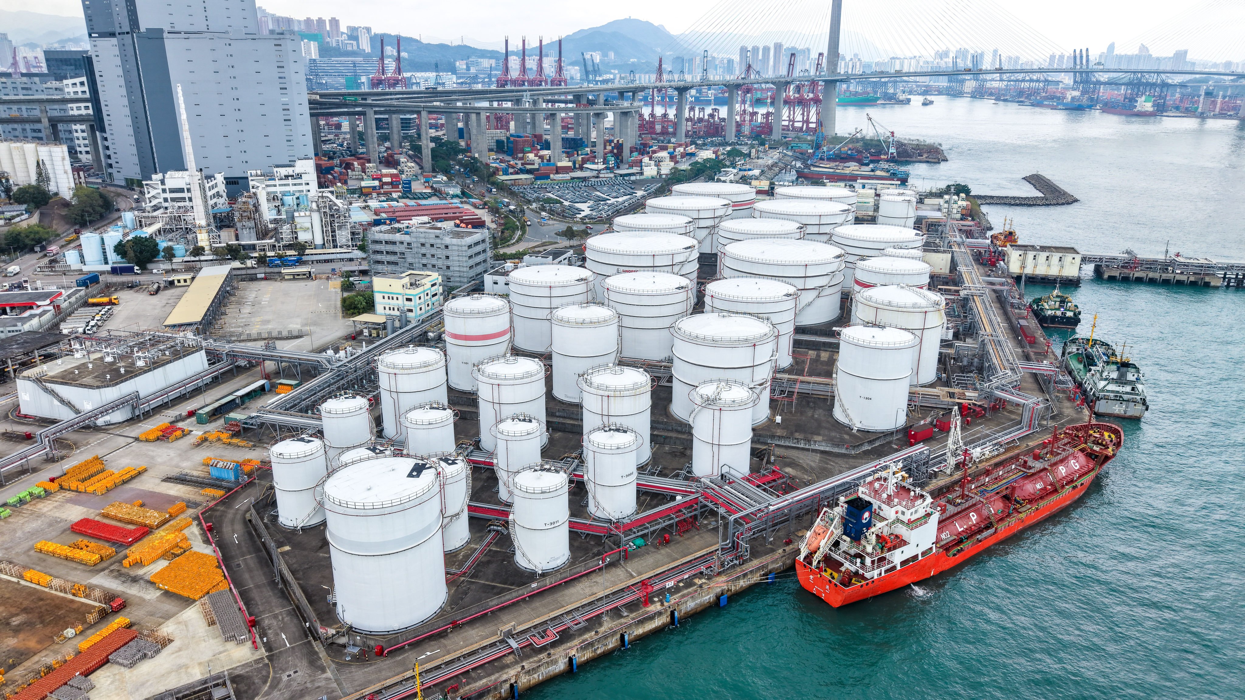 Oil storage tanks and oil tankers unloading at Tsing Yi depot, Hong Kong, on March 10. Photo: Sam Tsang