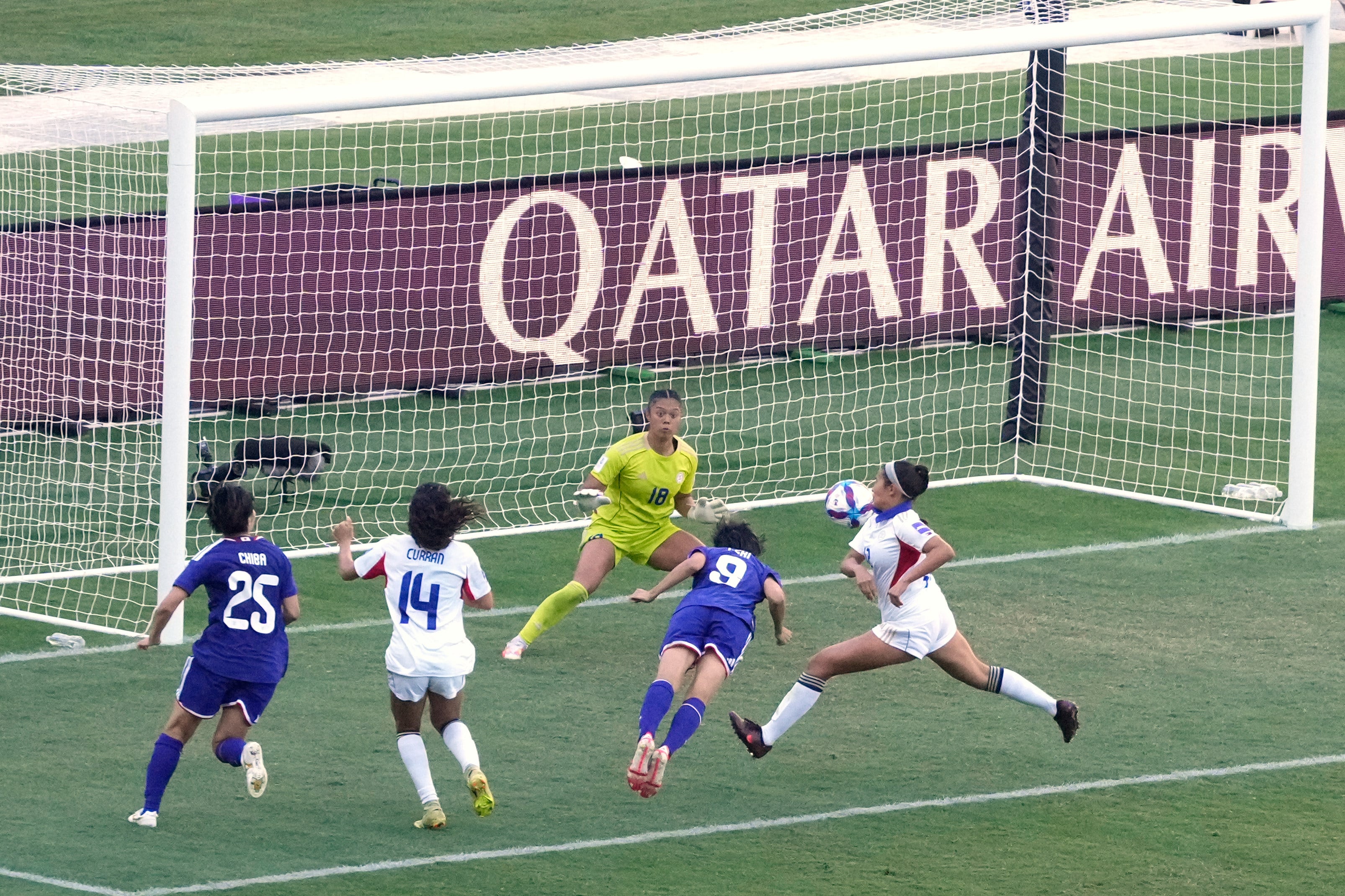 Japan’s Riko Ueki (number 9) heads past Philippines’ goalkeeper Nina Meollo in their 7-0 quarter-final win in Sydney on Sunday. Photo: AP