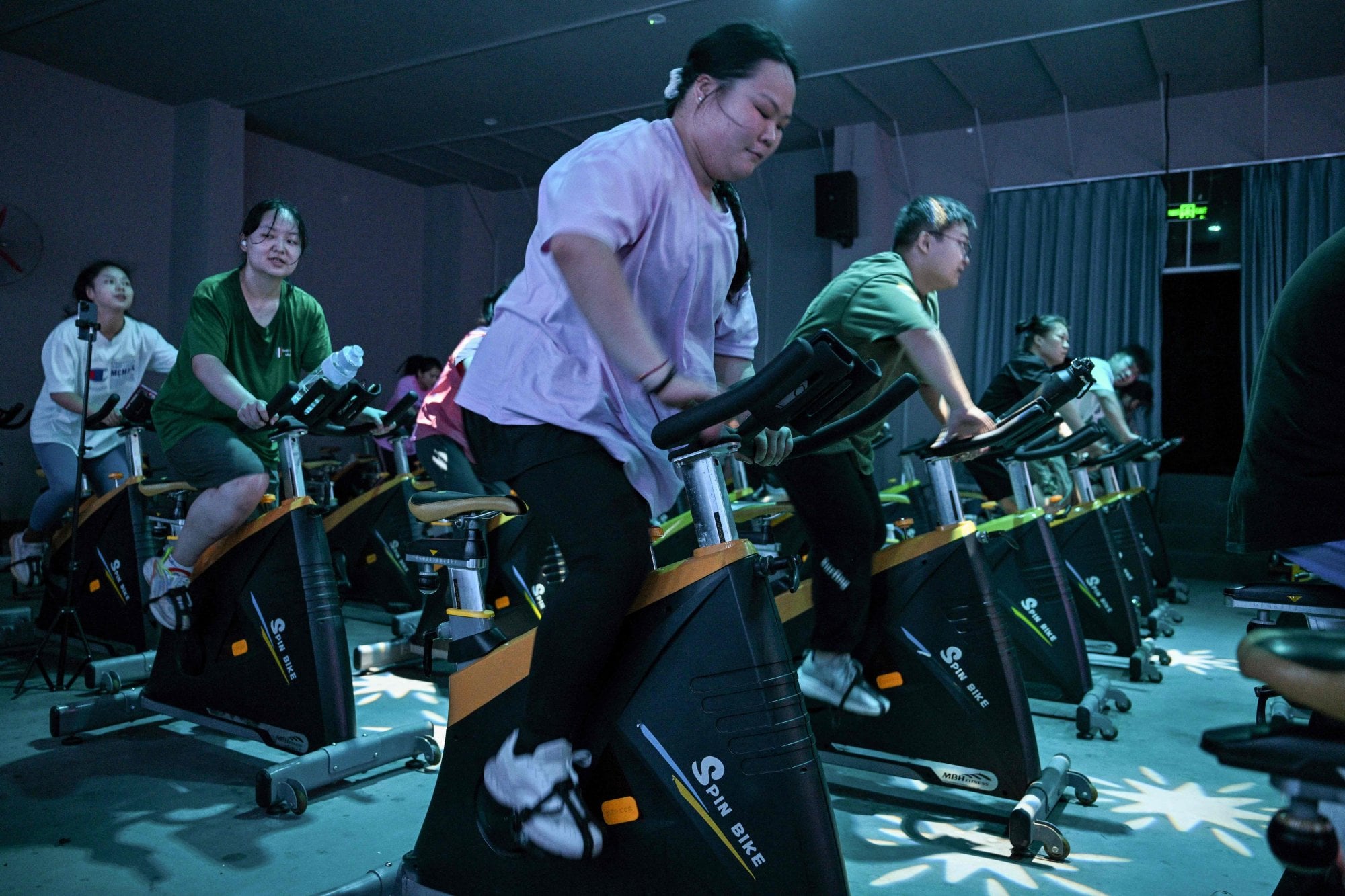 Overweight people exercising at a weight loss camp in China. Photo: AFP