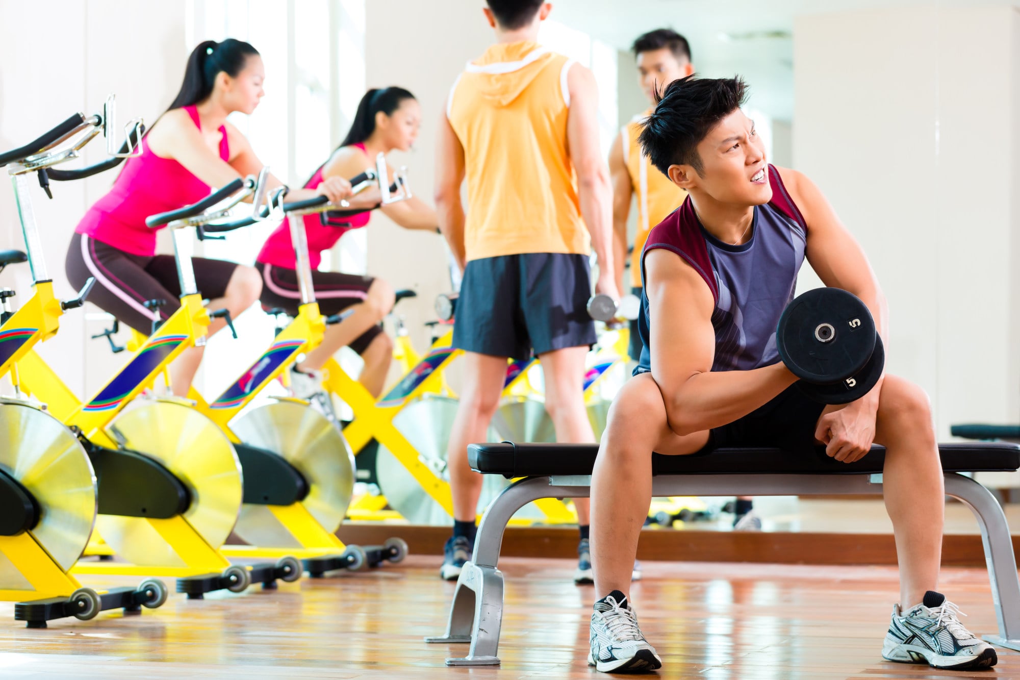 Young Chinese people exercise at a gym in a bid to shed weight and build muscle. Photo: Shutterstock