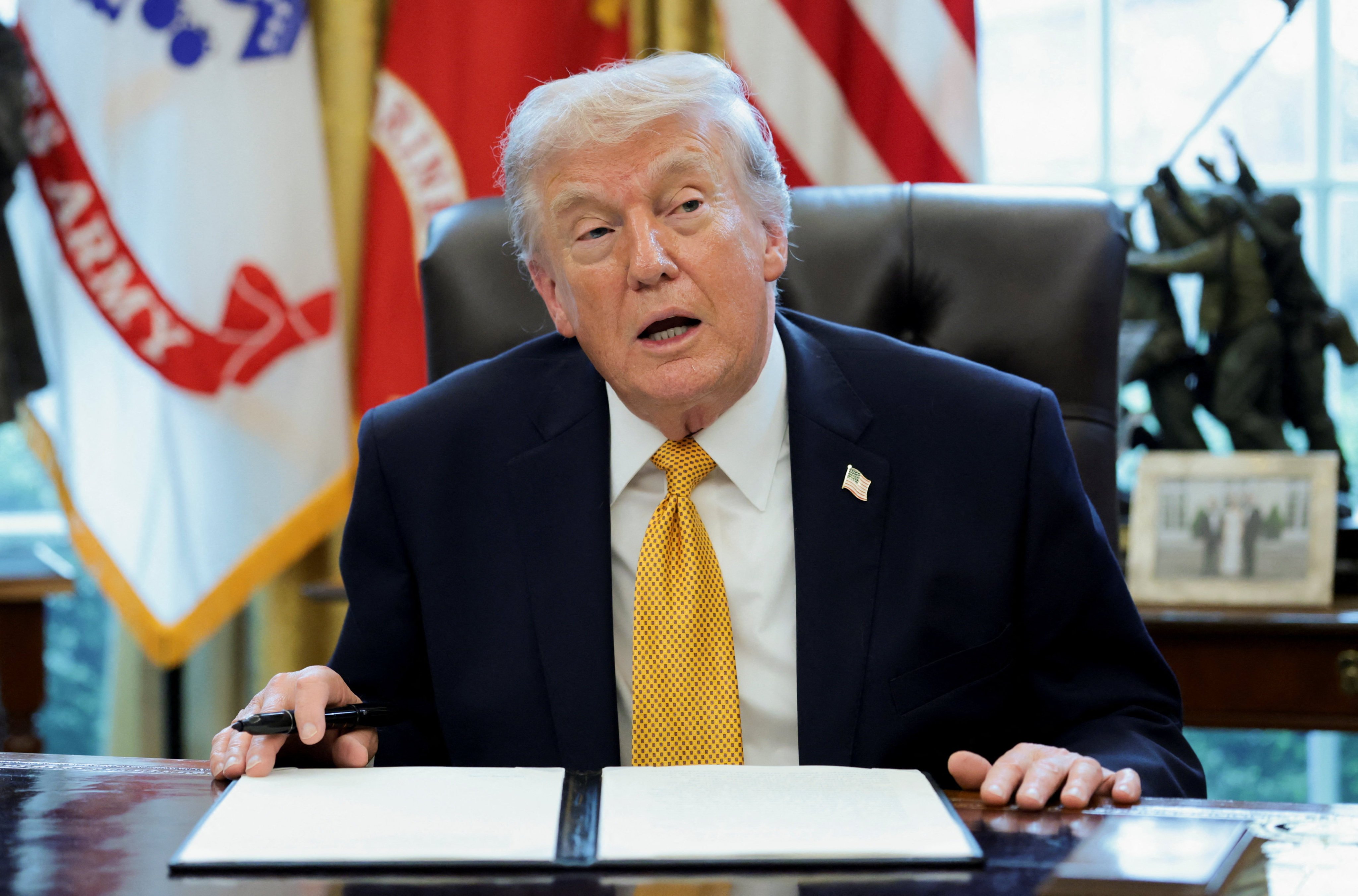 U.S. President Donald Trump speaks during an event to sign an executive order creating an anti‑fraud task force headed by U.S. Vice President JD Vance in the Oval Office at the White House in Washington, D.C., U.S., March 16, 2026. REUTERS/Jonathan Ernst
