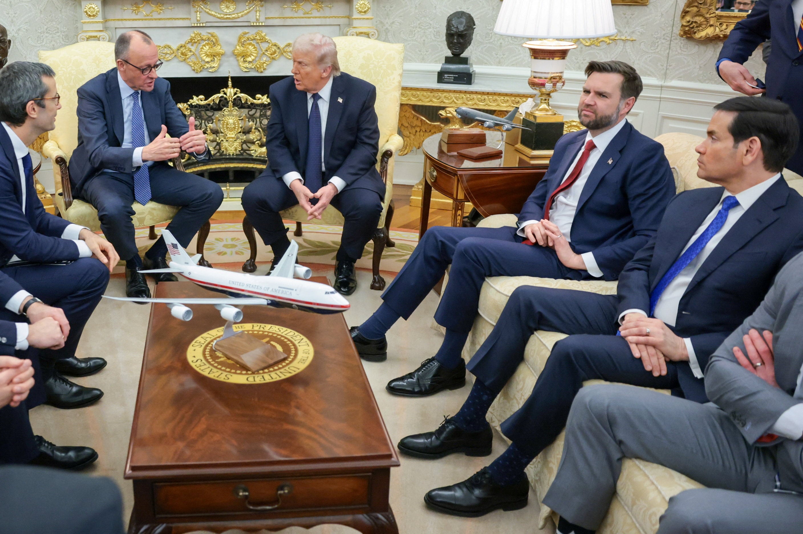 US President Donald Trump (third from left) appears to love Florsheim footwear, although the brand’s owners have sued him over tariff refunds. Photo: Reuters