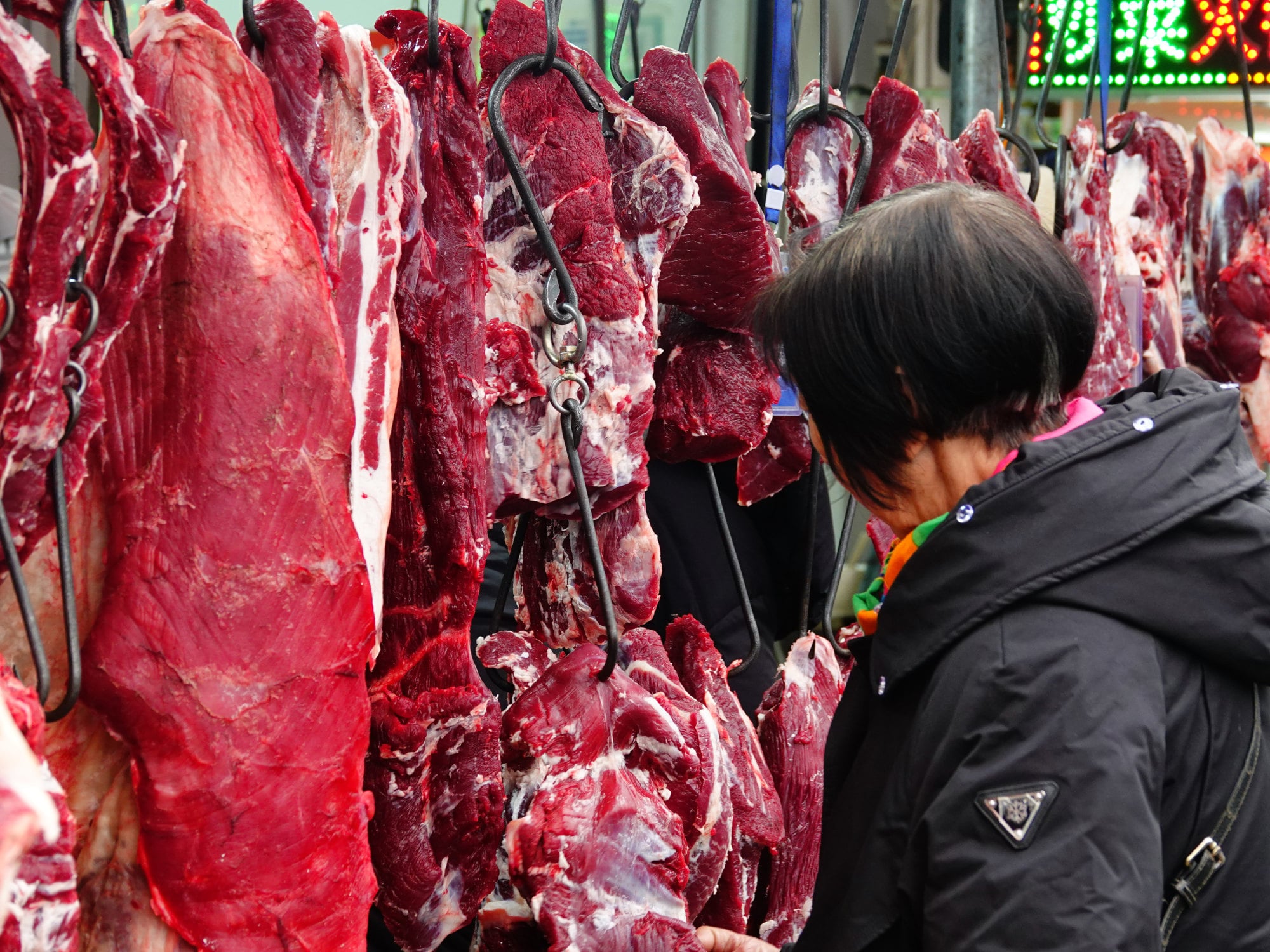 Hanging beef for sale at a market in China. Hundreds of people have signed up for the initiative. Photo: Getty Images