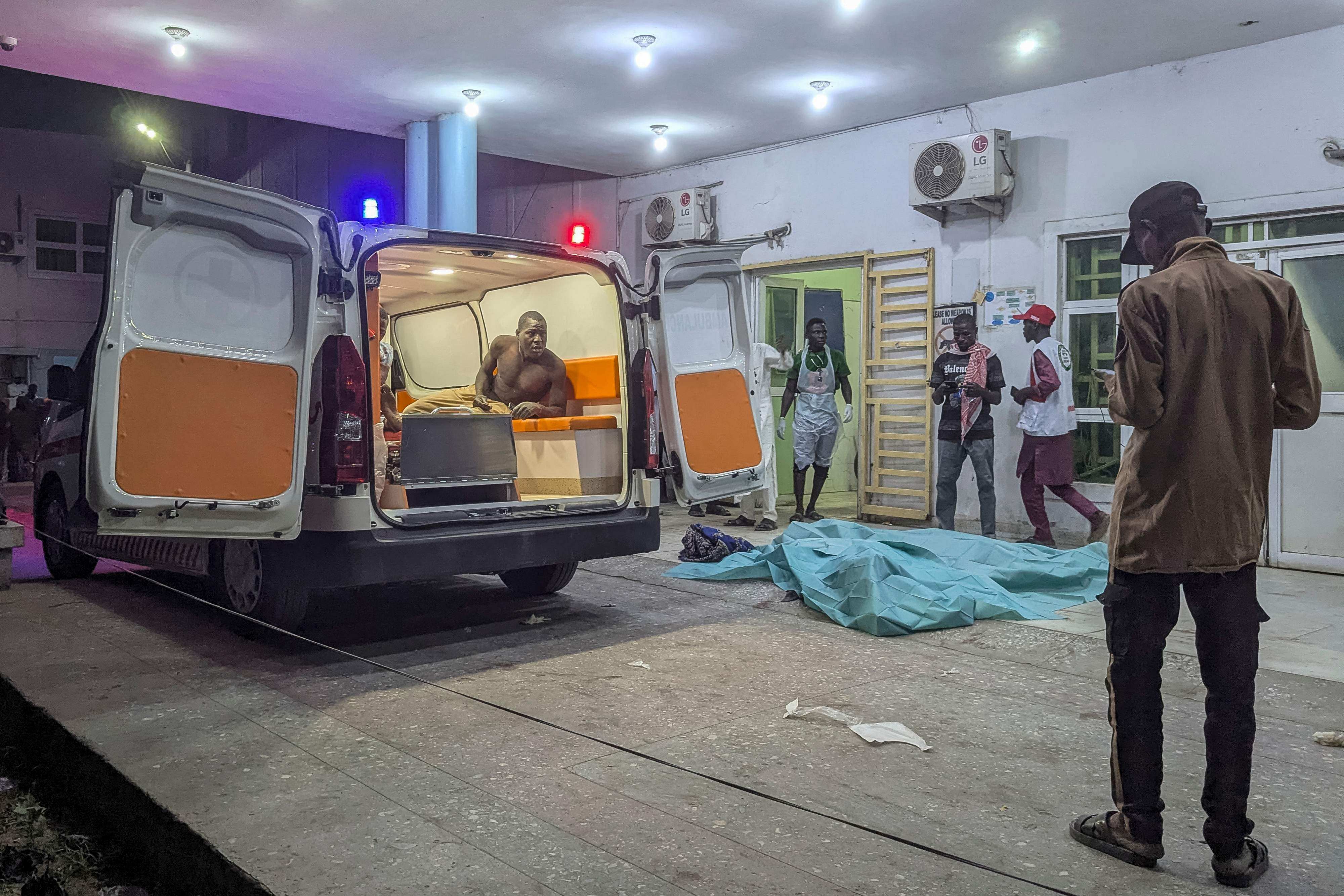 An injured man looks out of an ambulance at a hospital in Maiduguri. Photo: AFP
