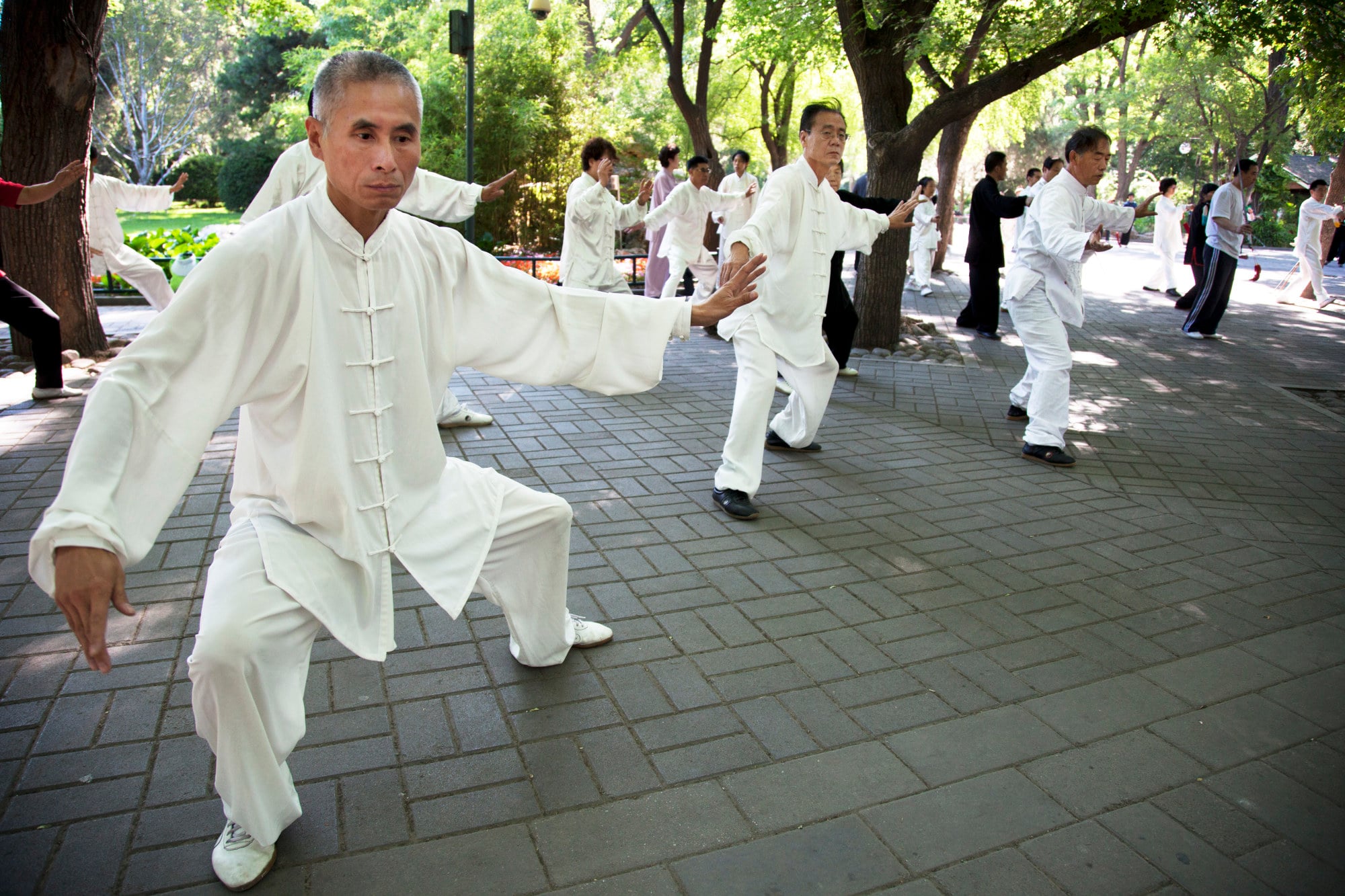 Elderly people do their morning tai chi chuan exercises in Zizhuyuan Park, Beijing. Photo: Getty Images