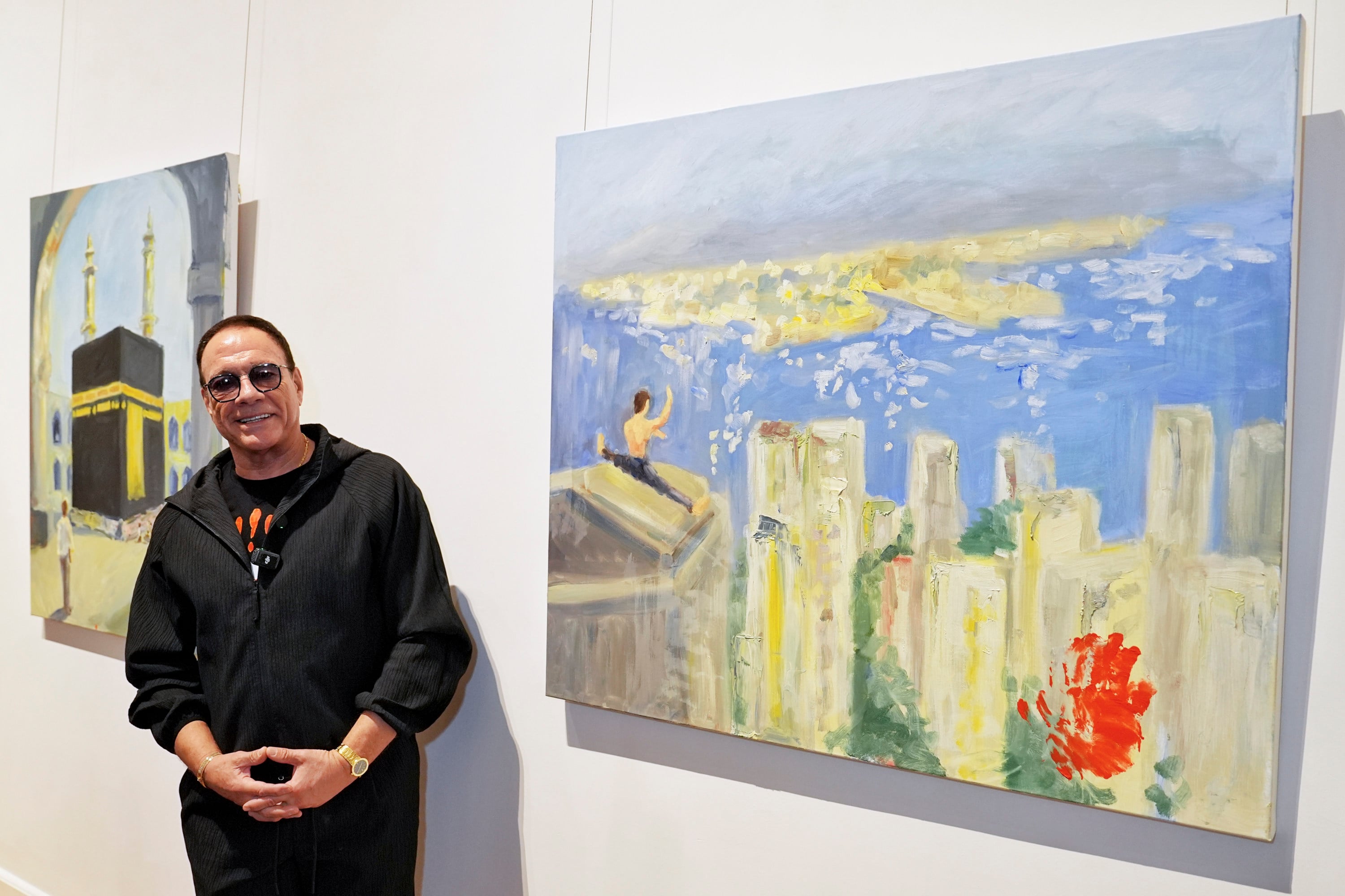 Jean-Claude Van Damme with his artworks in an exclusive painting vernissage of his city-themed oil paintings in Hong Kong at the University Museum and Art Gallery of the University of Hong Kong on March 7, 2026. Photo: Elson Li