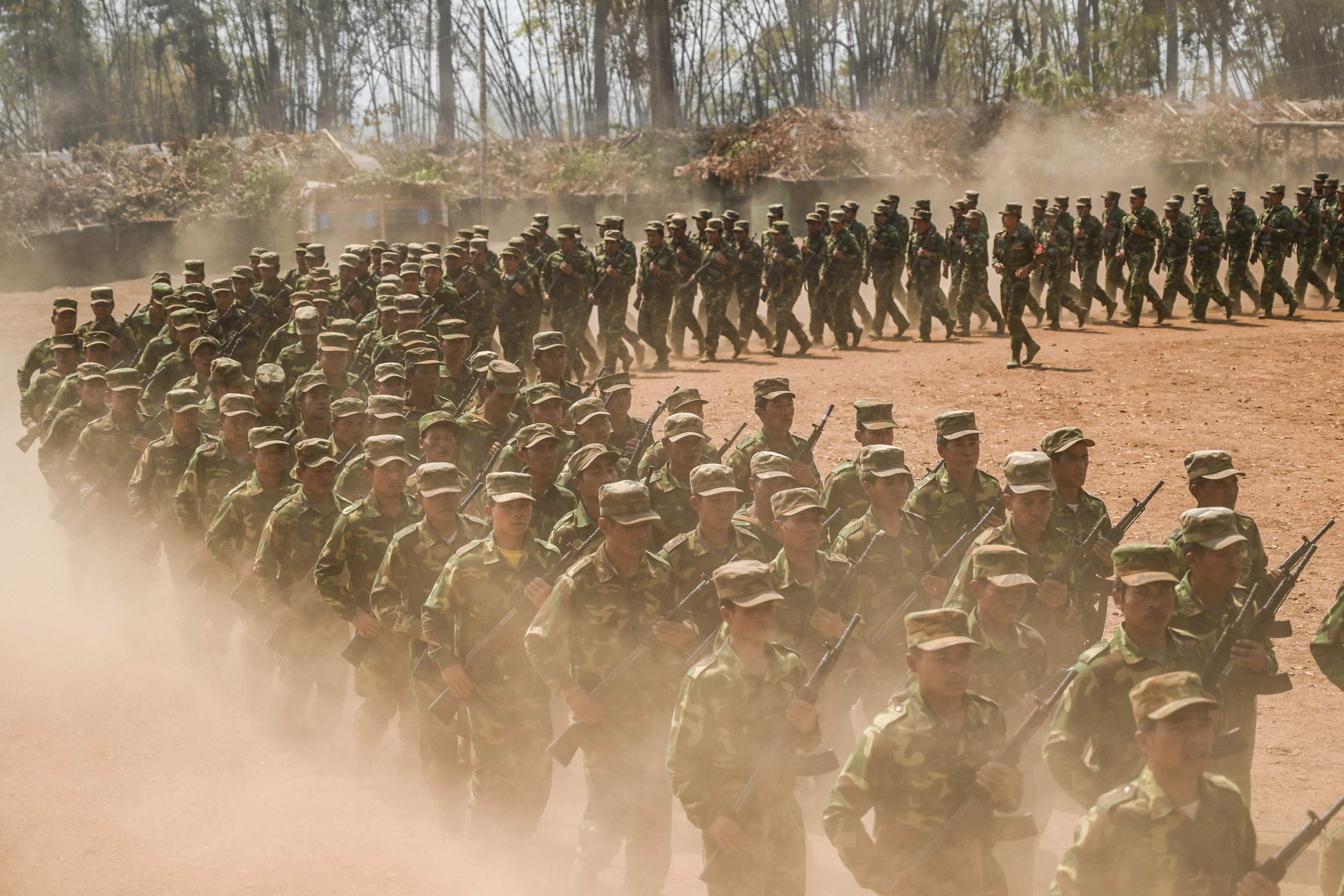 Members of ethnic rebel group Ta’ang National Liberation Army take part in a training exercise at their base camp in Myanmar’s northern Shan State. Photo:  AFP