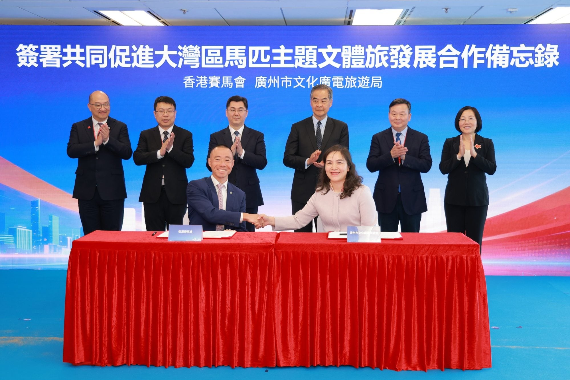 Hong Kong Jockey Club's Ronald Chan (front left) and Guangzhou Tourism Bureau's Li Ruolan (front right) signed the agreement. Photo: HKJC