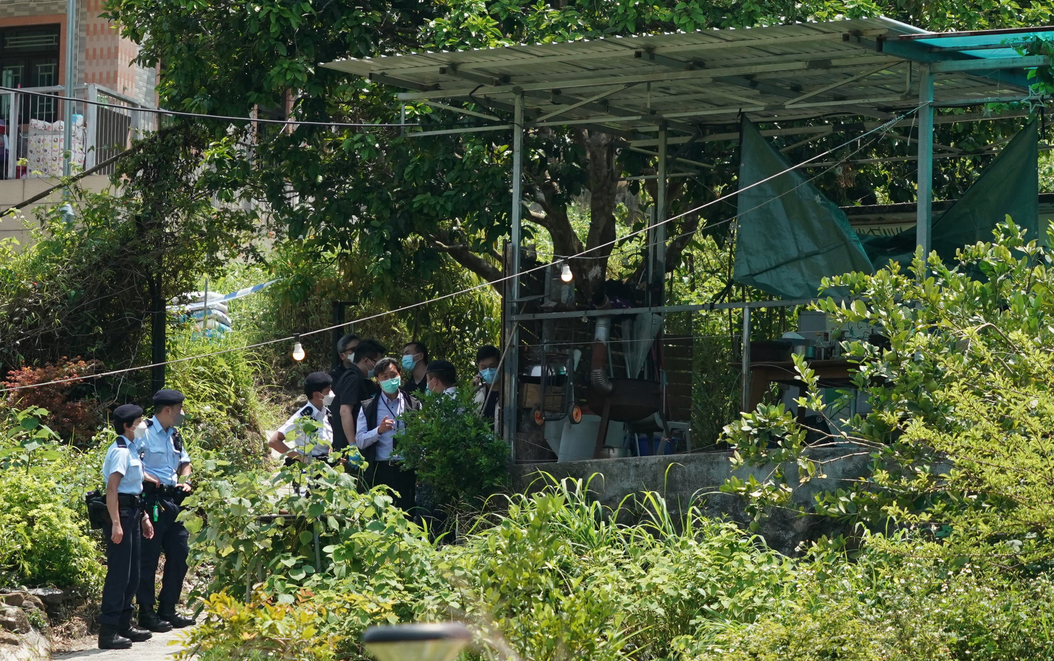 The woman’s body was found face down near the main entrance of the house in Mui Tsz Lam village. Photo: Felix Wong