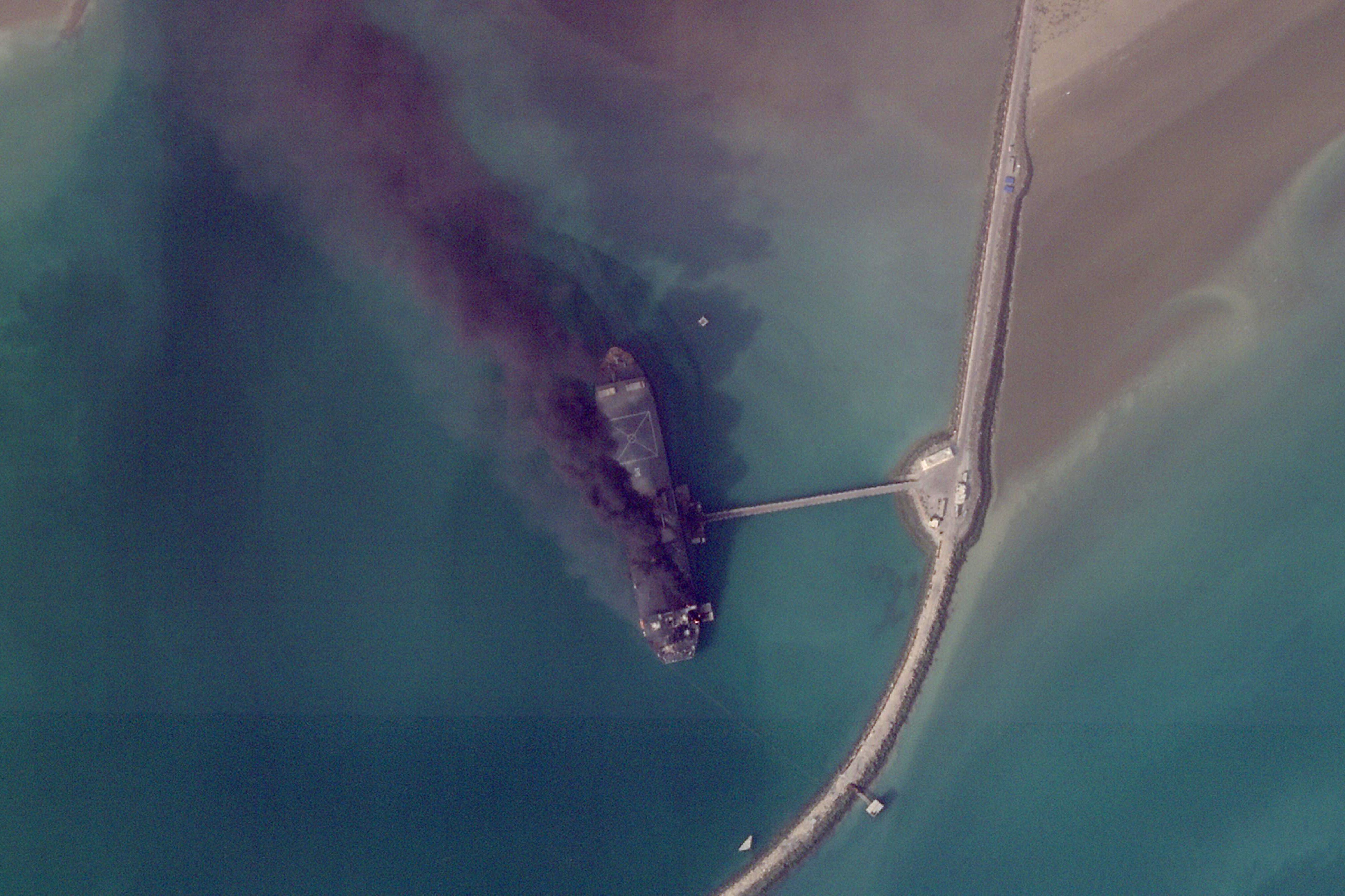 A burning ship after a US military attack on a port in Bandar Abbas, Iran on March 2. Photo: Planet Labs PBC via AP