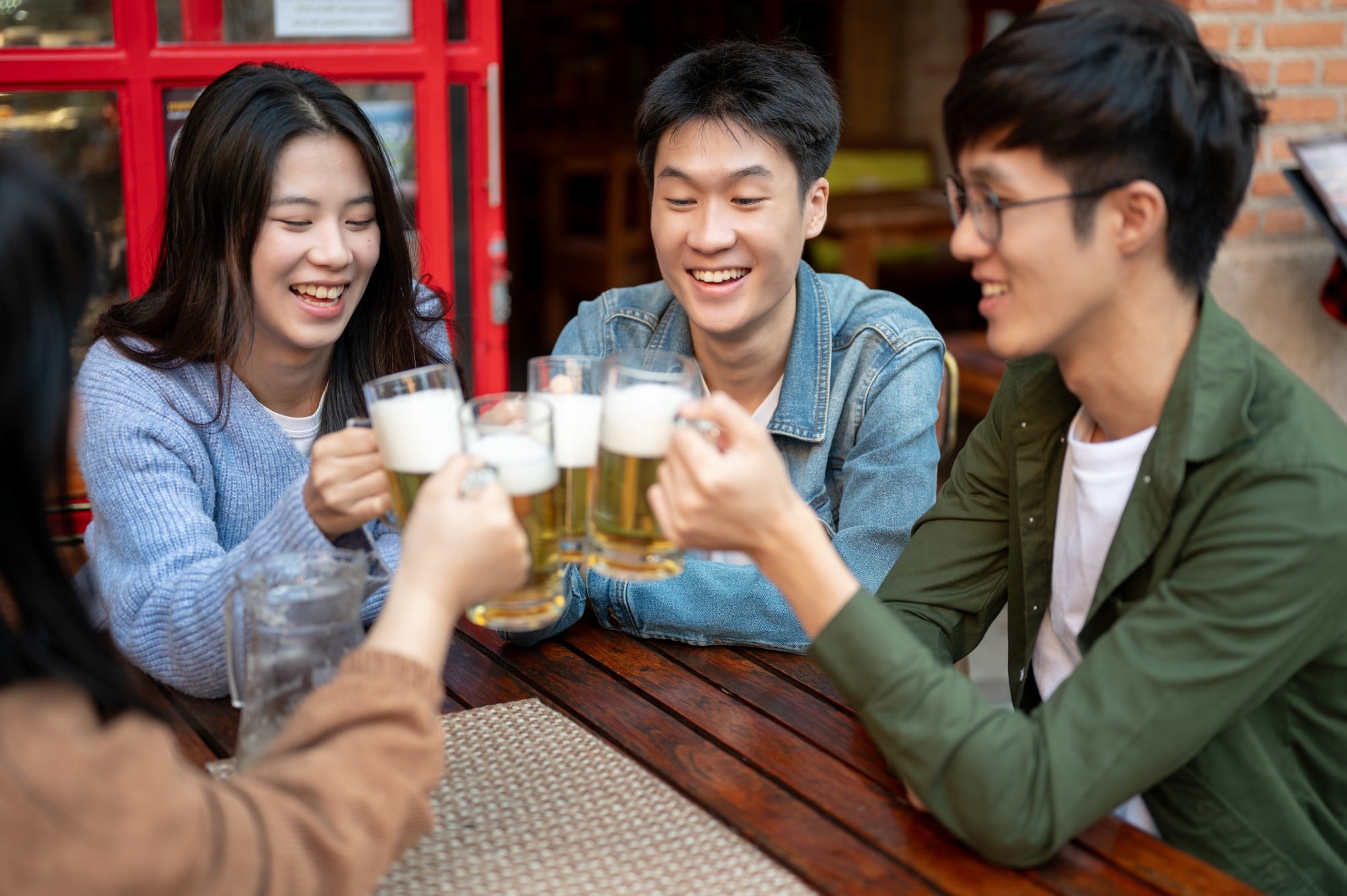 A group of young people toast each other with glasses of beer. The metal chopstick victim is understood to be a heavy drinker. Photo: Shutterstock A group of young people toast each other with glasses of beer. The metal chopstick victim is understood to be a heavy drinker. Photo: Shutterstock