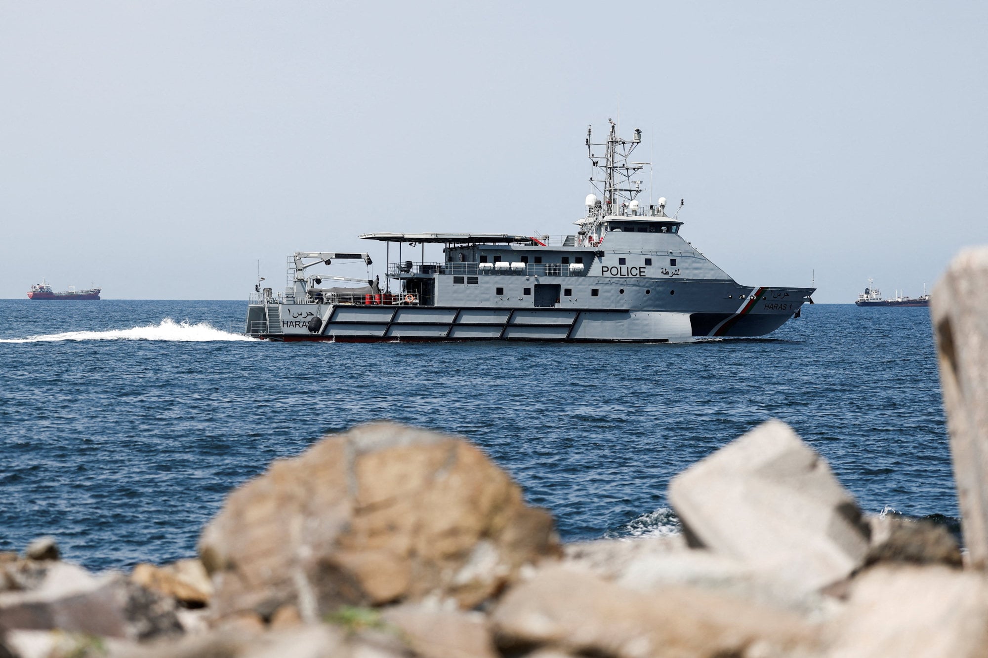 A Royal Oman Police Coast Guard patrol boat surveys the area in Muscat, Oman, as traffic is down in the Strait of Hormuz. Photo: Reuters A Royal Oman Police Coast Guard patrol boat surveys the area in Muscat, Oman, as traffic is down in the Strait of Hormuz. Photo: Reuters