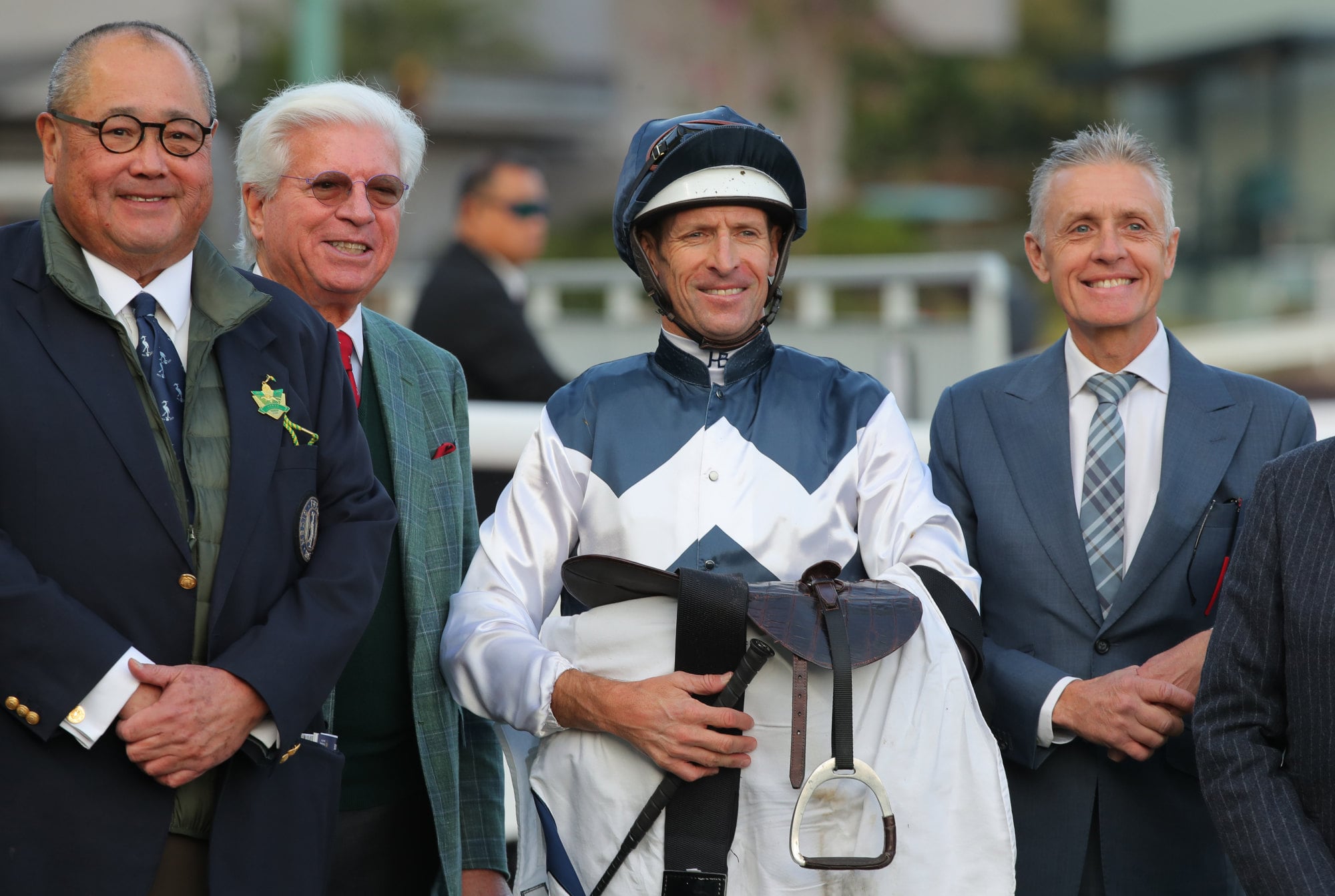 Trainer Mark Newnham (right), jockey Hugh Bowman and members of the Ibis Syndicate celebrate Invincible Ibis’ win in January.