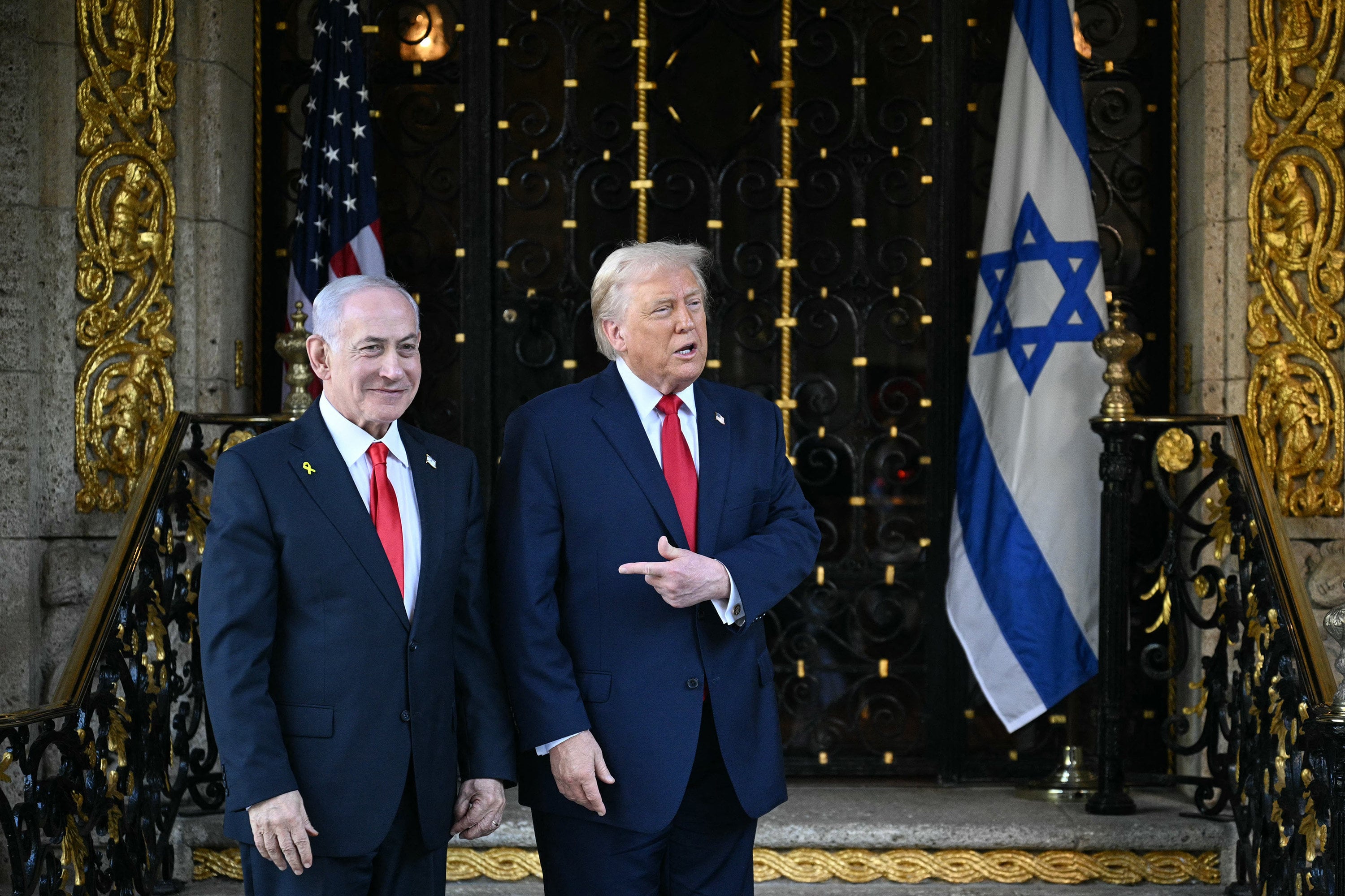 US President Donald Trump (right) greets Israeli Prime Minister Benjamin Netanyahu on arrival at Trump’s Mar-a-Lago residence in Palm Beach, Florida, on December 29, 2025. The two met again at the White House in February 2026. Photo: AFP/Getty Images/TNS