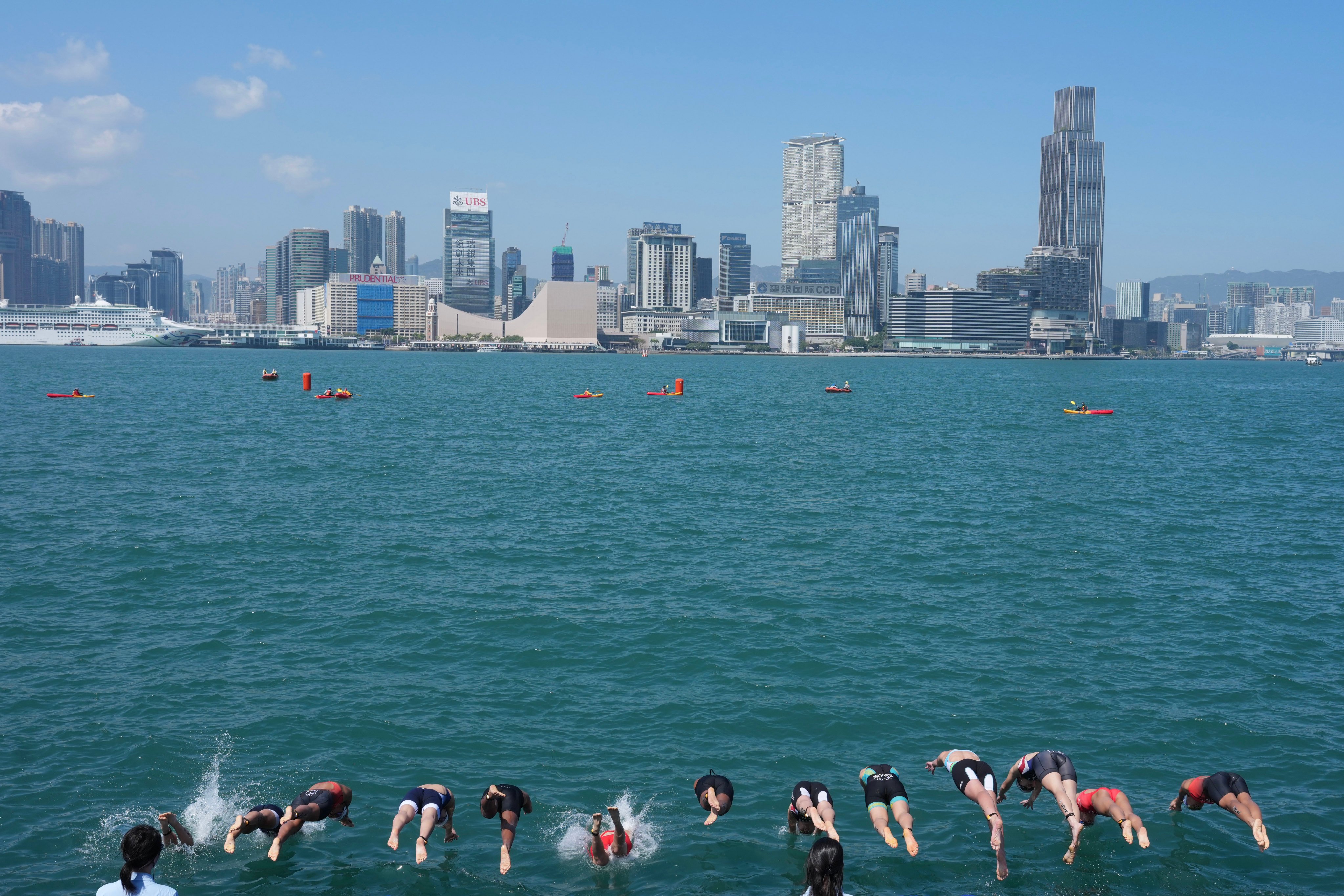 Athletes enter the water at the start of the under-23 mixed team relay at the Asian Triathlon Championships. Photo: Karma Lo