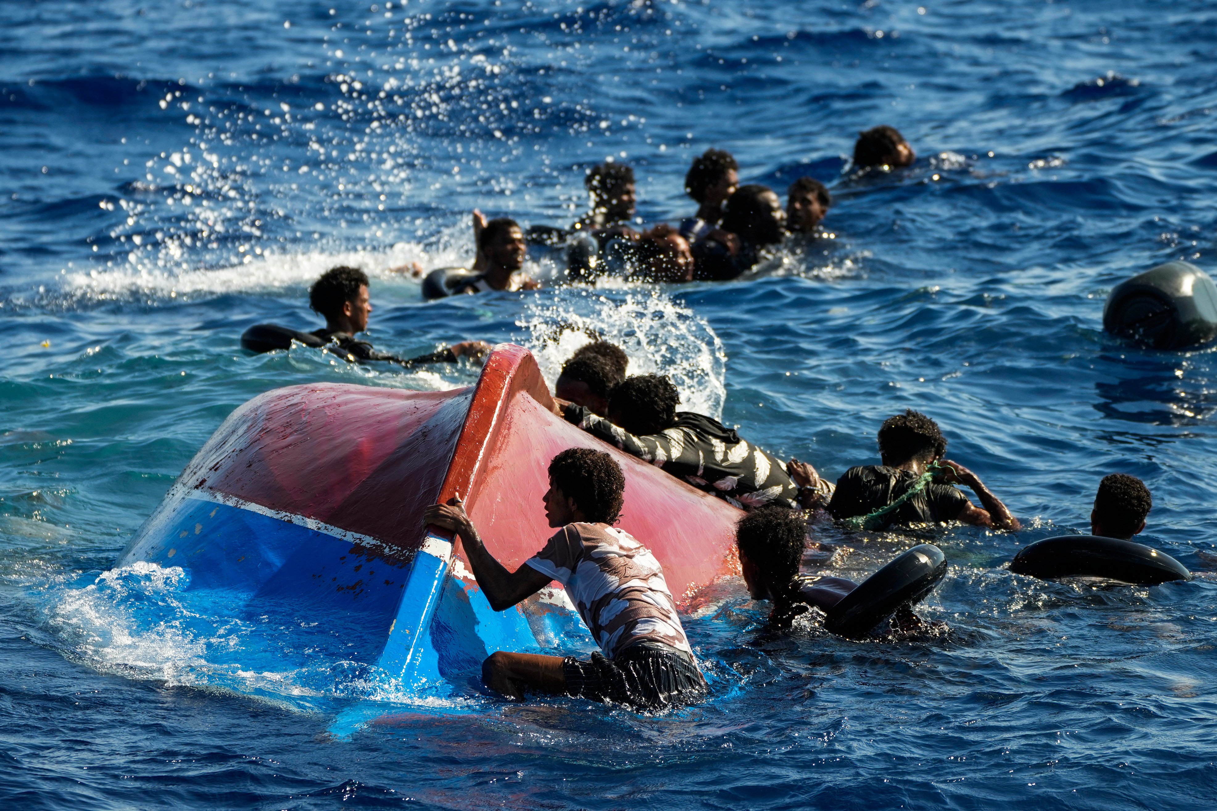 Migrants from Syria and Libya call for help as they are assisted by Spanish NGO Open Arms south of the Italian island of Lampedusa in 2022. Photo: AP