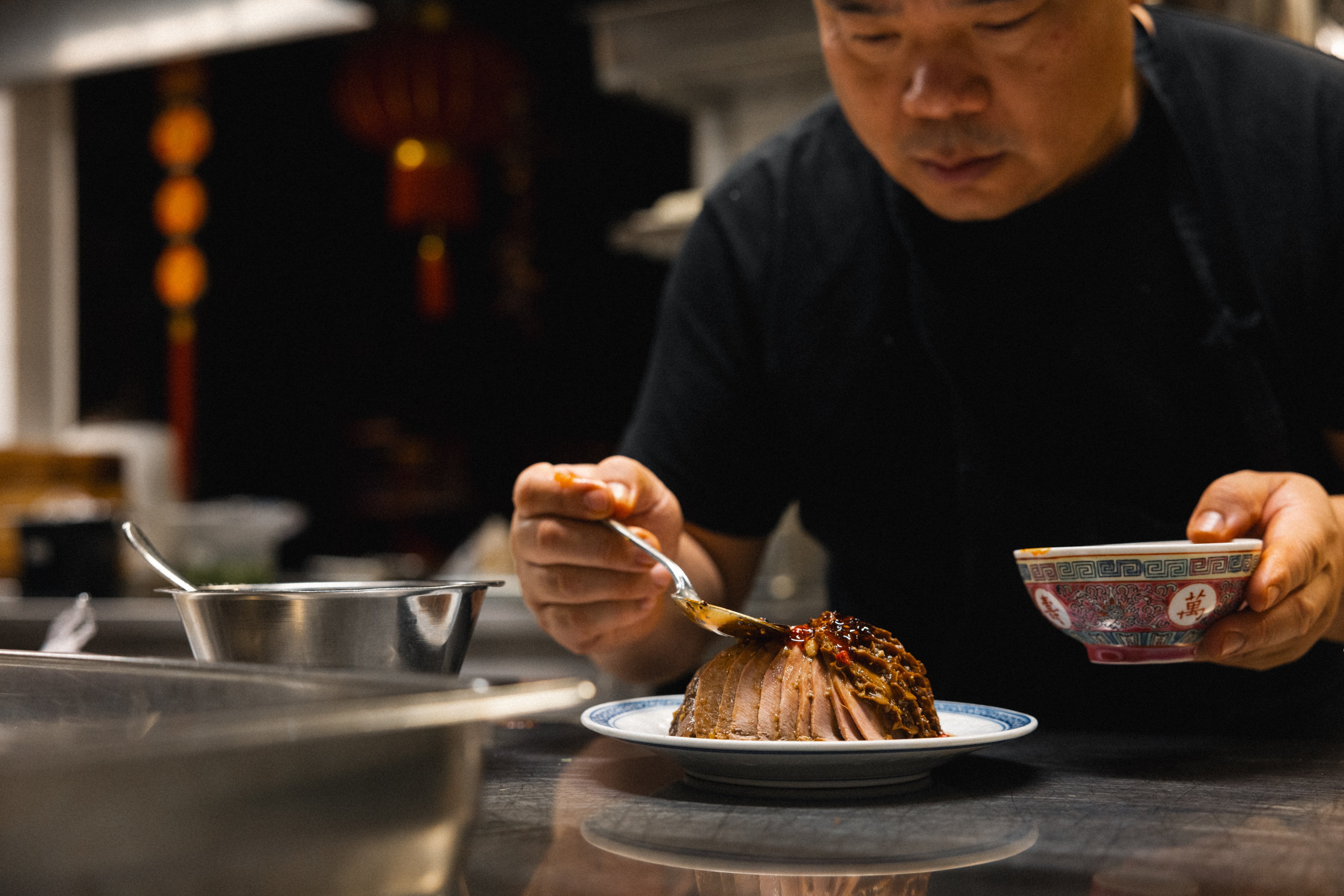 Surfers chef Cao Dayu prepares a dish at the Chinese restaurant in Stockholm, Sweden. The restaurant has come a long way from its humble roots on a Swedish island to become one of the capital’s most popular Chinese restaurants. Photo: Emil Lif