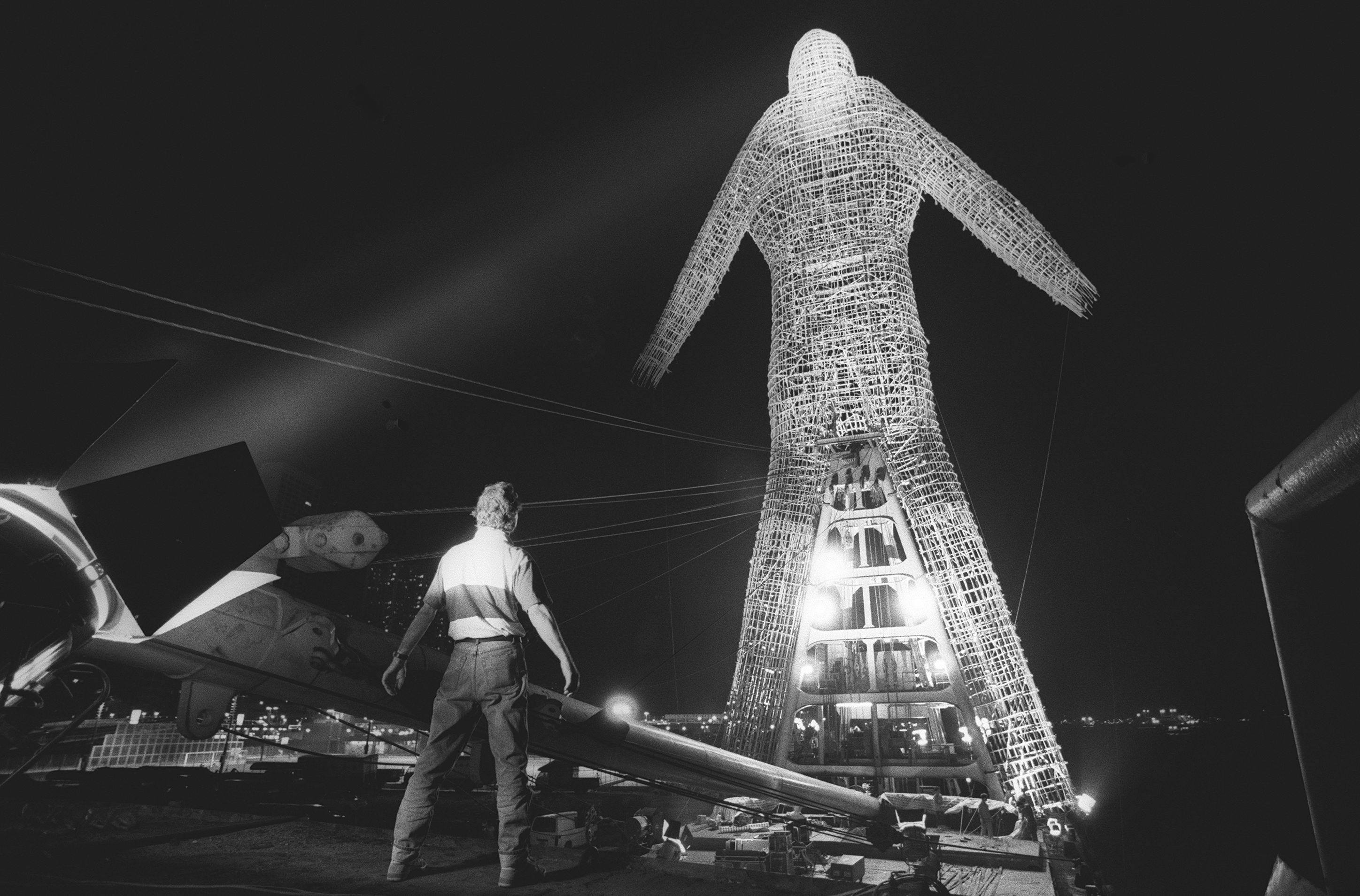 The Bamboo Man sculpture by multimedia artist André Heller is lit up in readiness for its journey across Victoria Harbour in May 1992. Photo: SCMP Archives