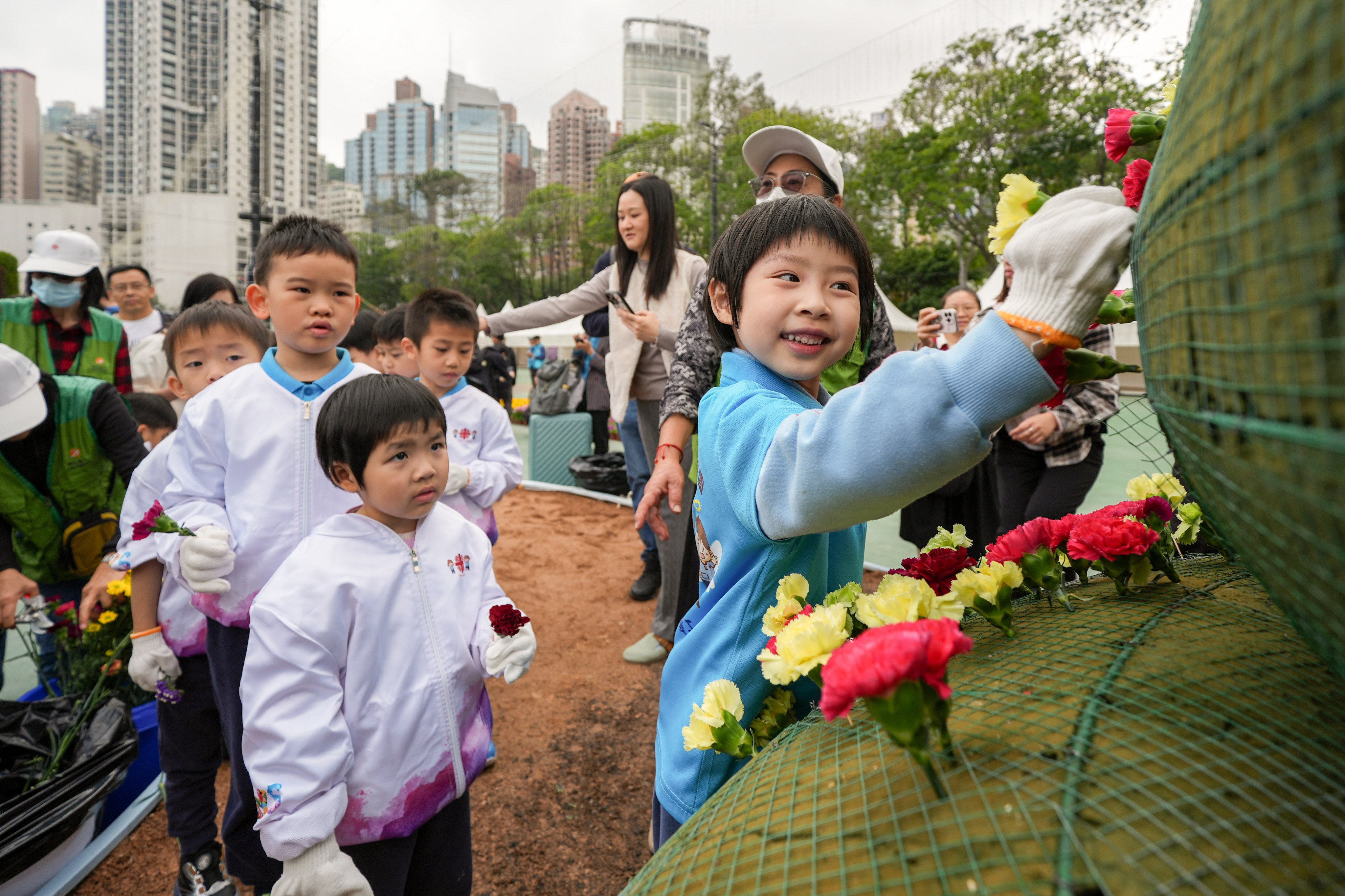 More than 1,100 students from 38 kindergartens, primary, secondary and special schools join hands to create a horticultural display as part of the Hong Kong Flower Show at Victoria Park, on March 7. Photo: Eugene Lee