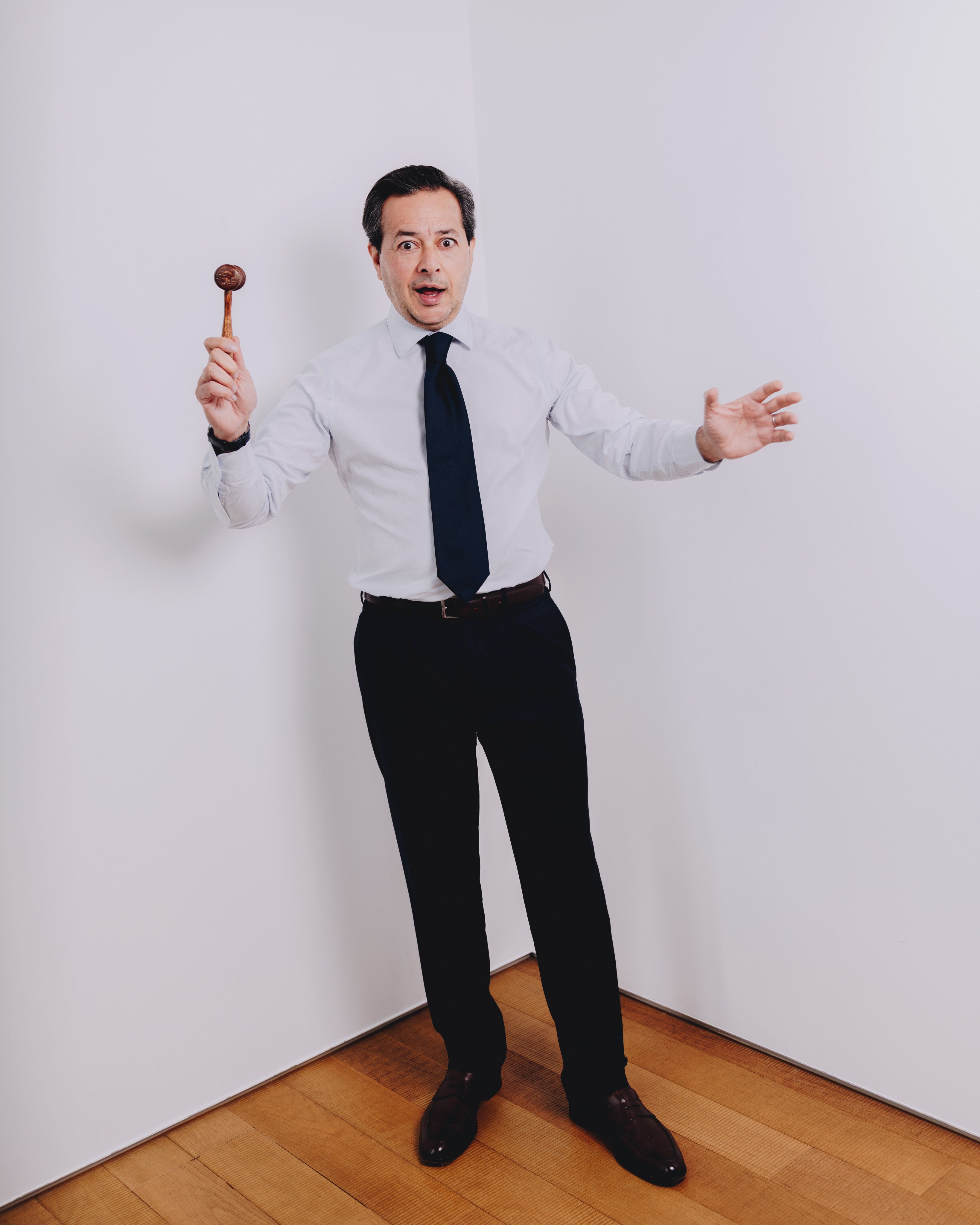 Christie’s auctioneer Rahul Kadakia and his billion-dollar gavel. Photo: Jocelyn Tam