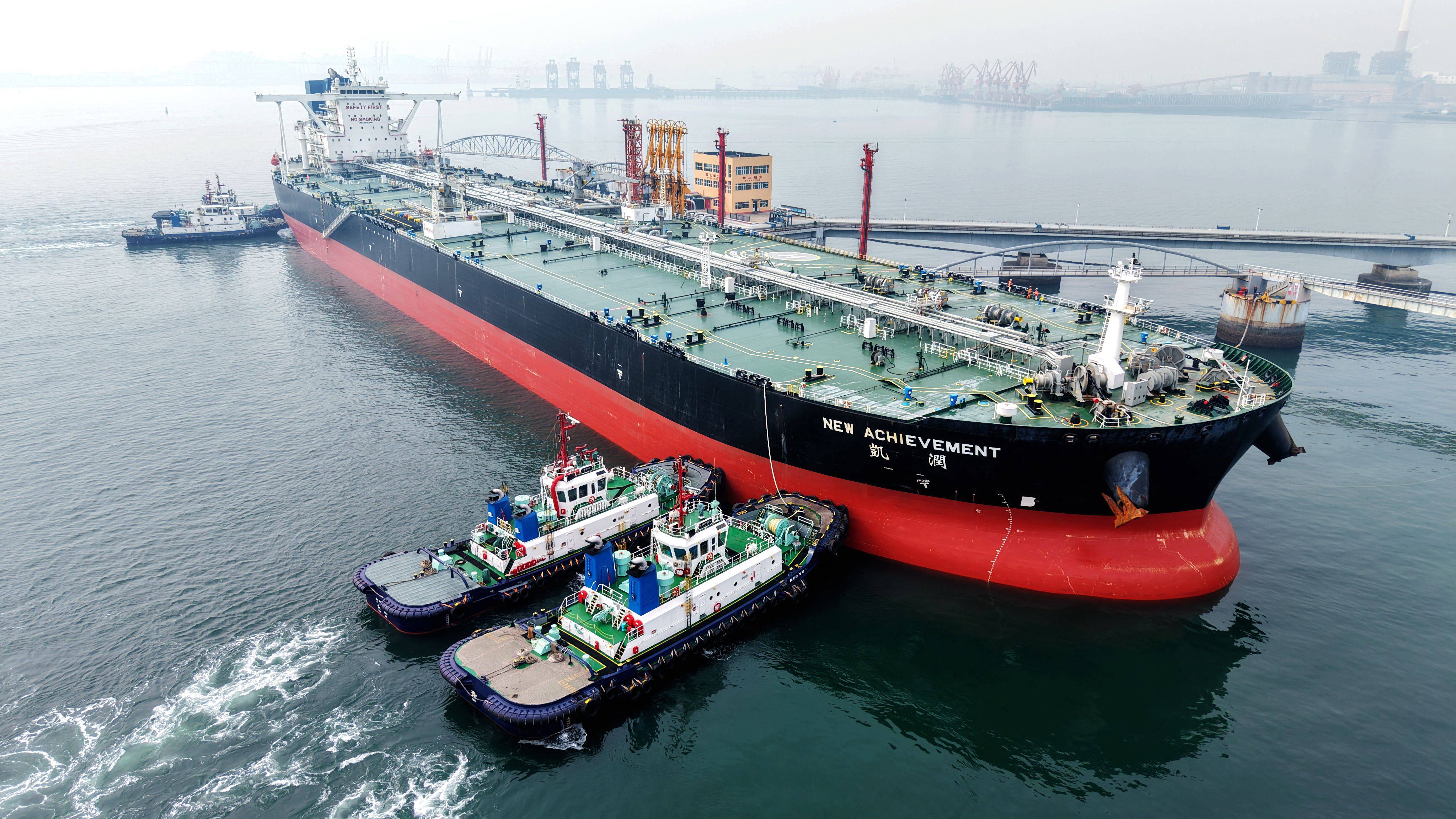 An oil tanker is guided to a berth at a port in Qingdao, Shandong province. China has oil reserves of 1.3 billion barrels, enough for four months of supply, according to UBS Group and S&P Global. Photo: AFP