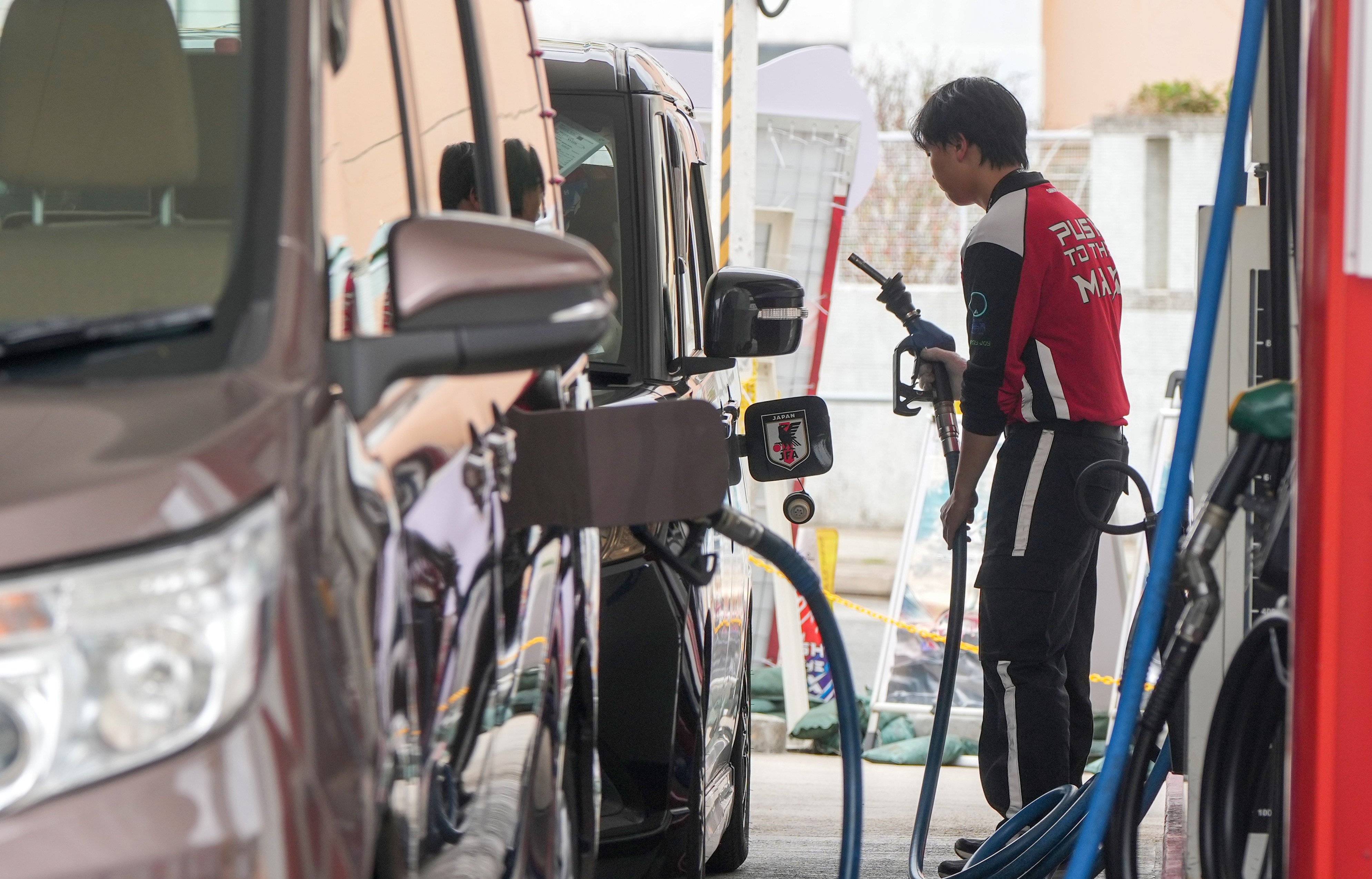 Vehicles get filled up at a petrol station in Sha Tin. Photo: Sam Tsang