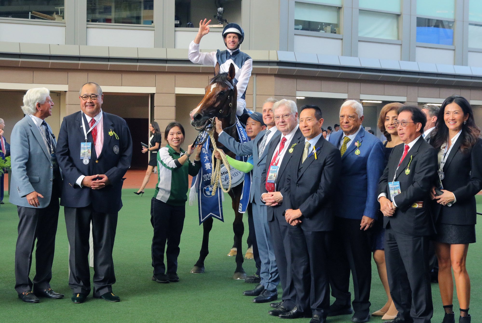 Connections of Invincible Ibis are all smiles after his Derby triumph.