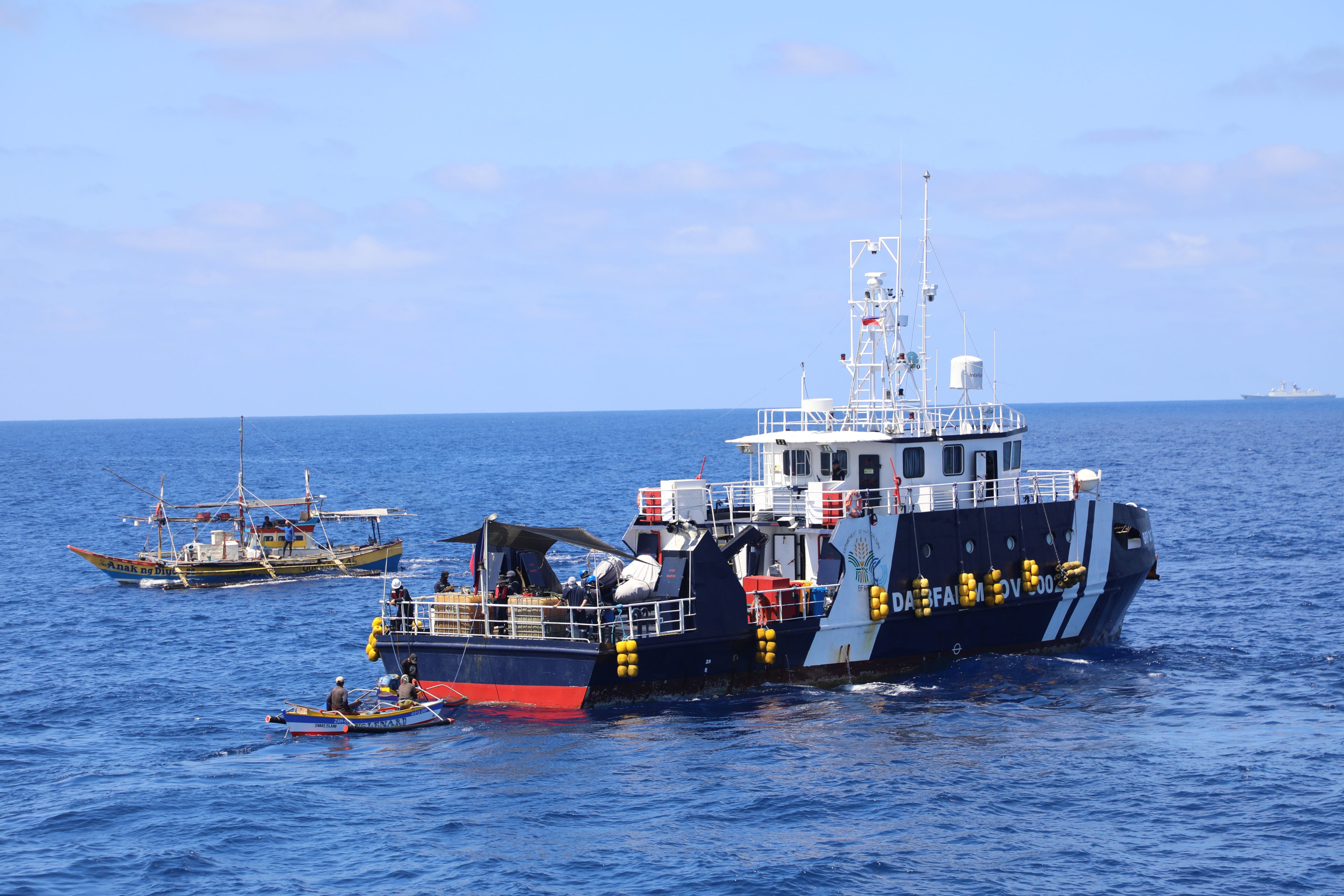 A Philippine vessel distributes supplies in the contested South China Sea last month. Photo: China’s coastguard/Xinhua