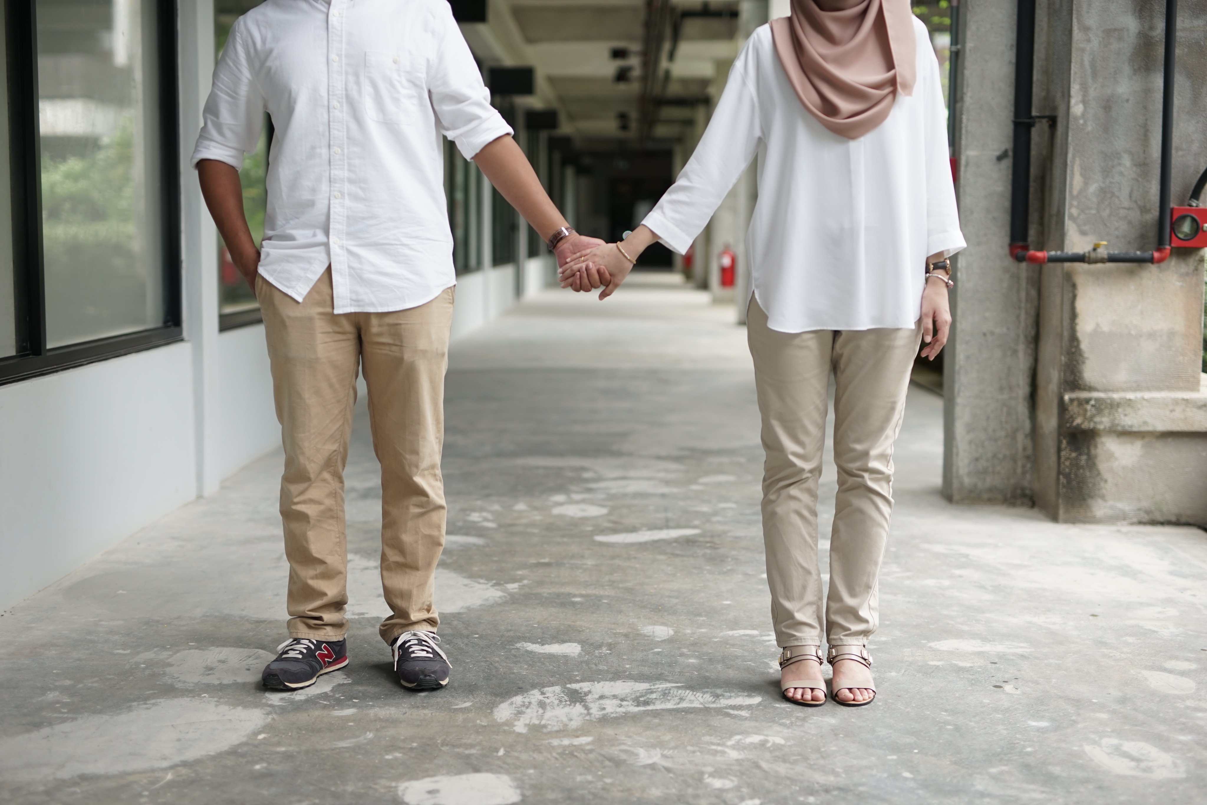 A Malaysian couple hold hands. A new study has found that 60 per cent of respondents from Malaysia agreed with the statement that “a wife should always obey her husband”. Photo: Shutterstock