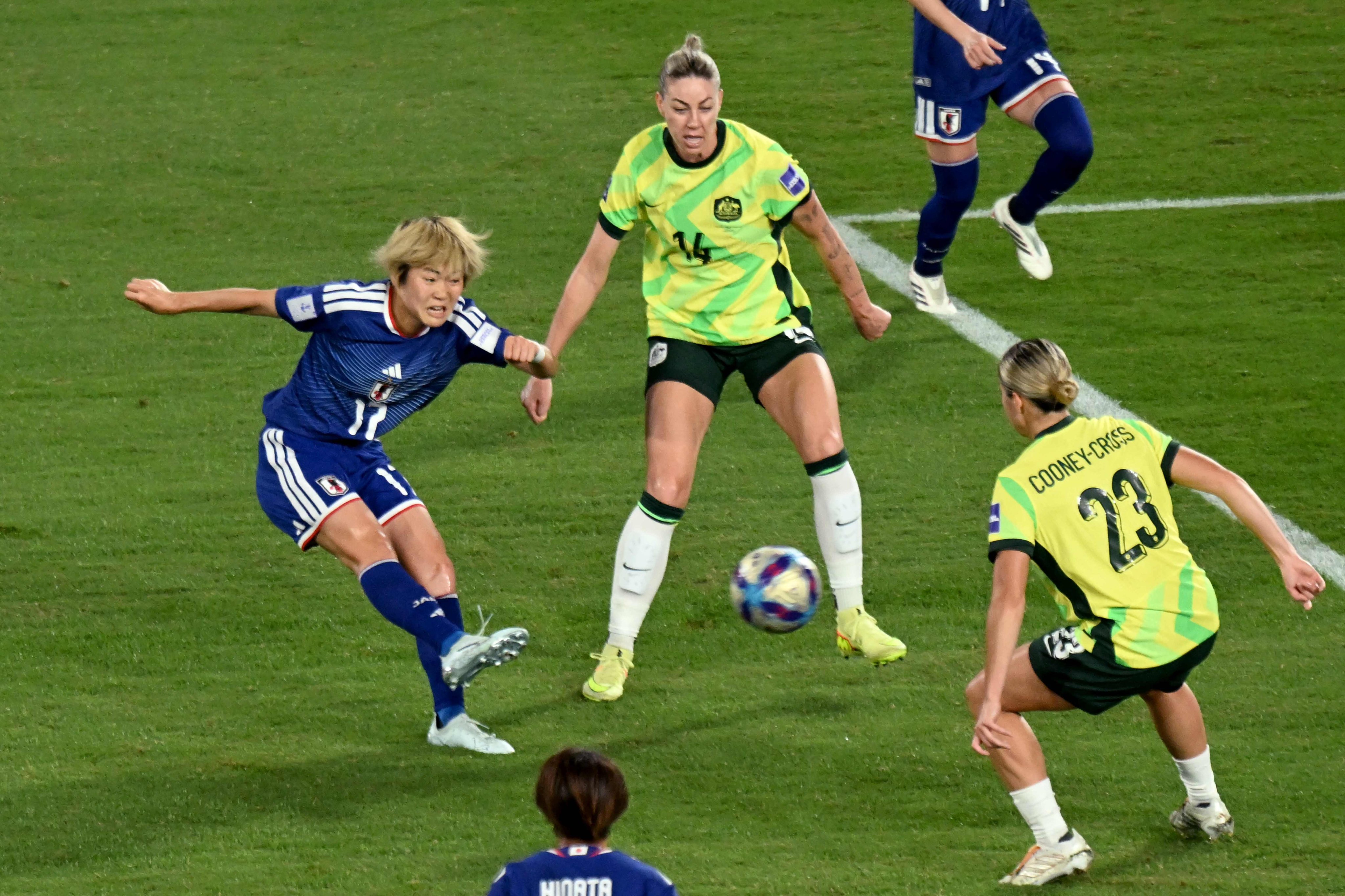 Japan’s England-based Maika Hamano (left) shoots and scores the winner in the final of the Womens Asian Cup against Australia on Saturday. Photo: AFP