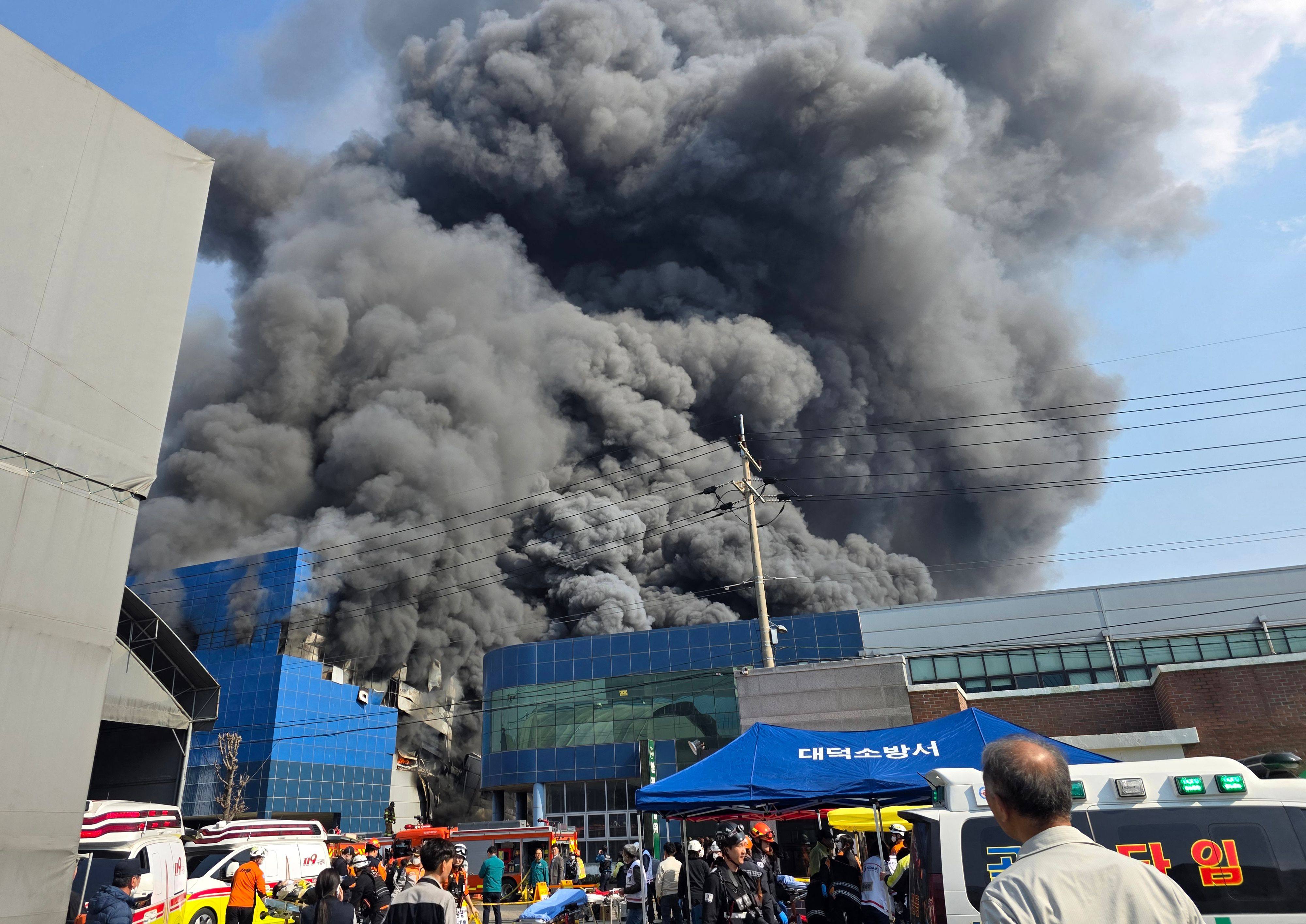Heavy smoke billows from the blaze at a car parts factory in Daejeon, South Korea, on Friday. Photo: Yonhap/AFP