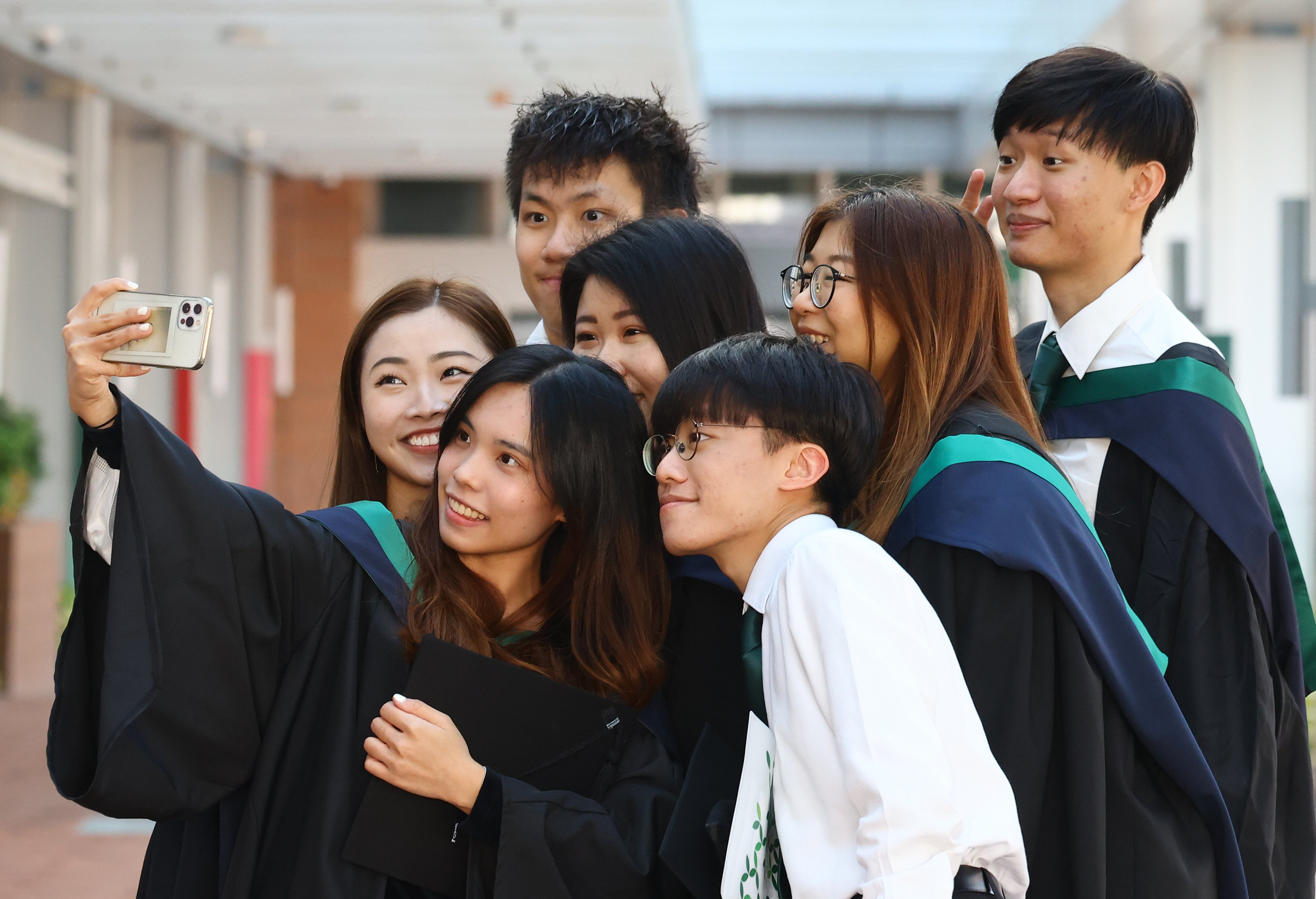 Graduating students take photos on the University of Hong Kong campus. Photo: Dickson Lee