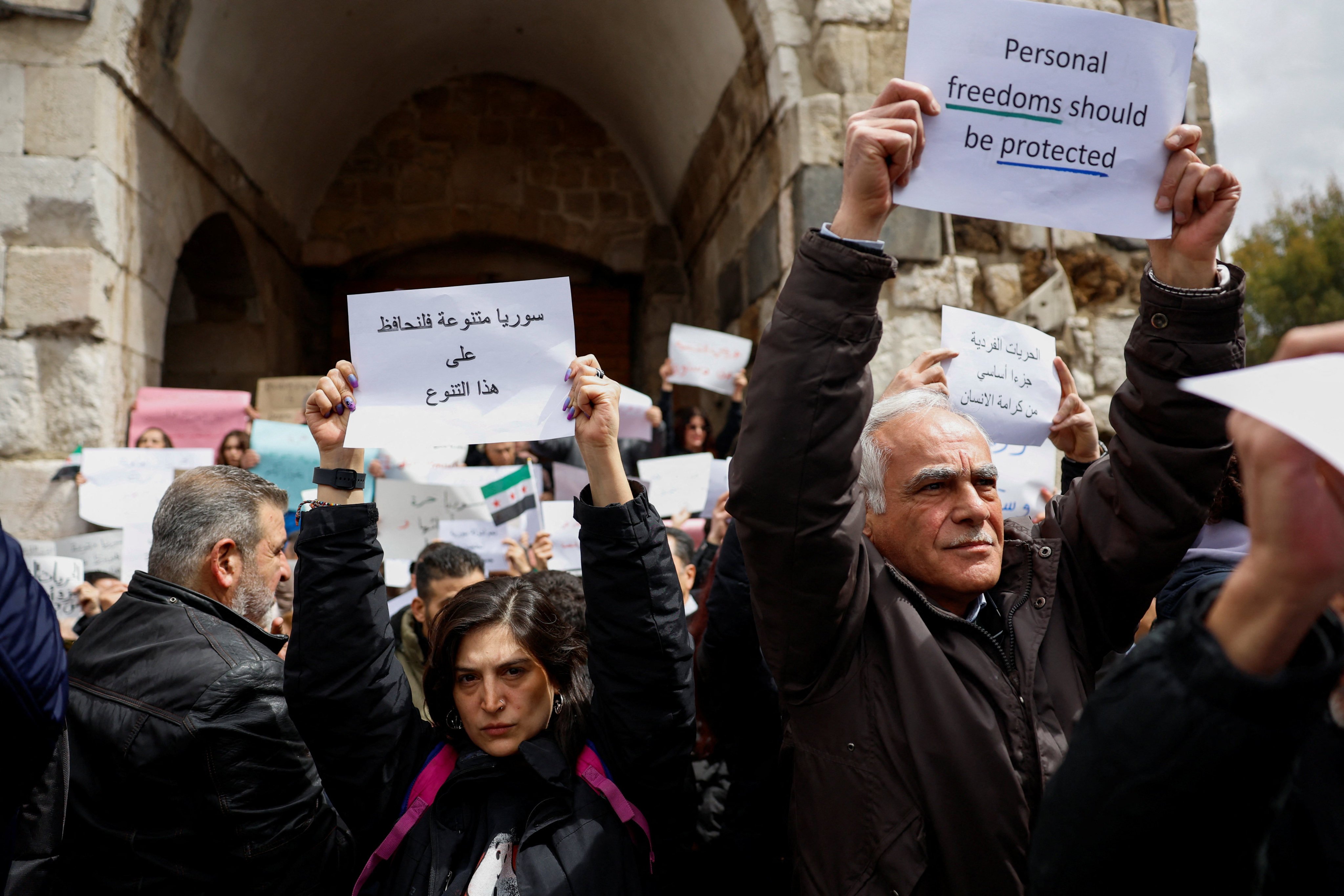 Syrians protest against the Damascus governorate’s decision to restrict alcoholic drinks sales to designated areas in the city, in Bab Touma Square, Damascus, Syria on Sunday. Photo: Reuters